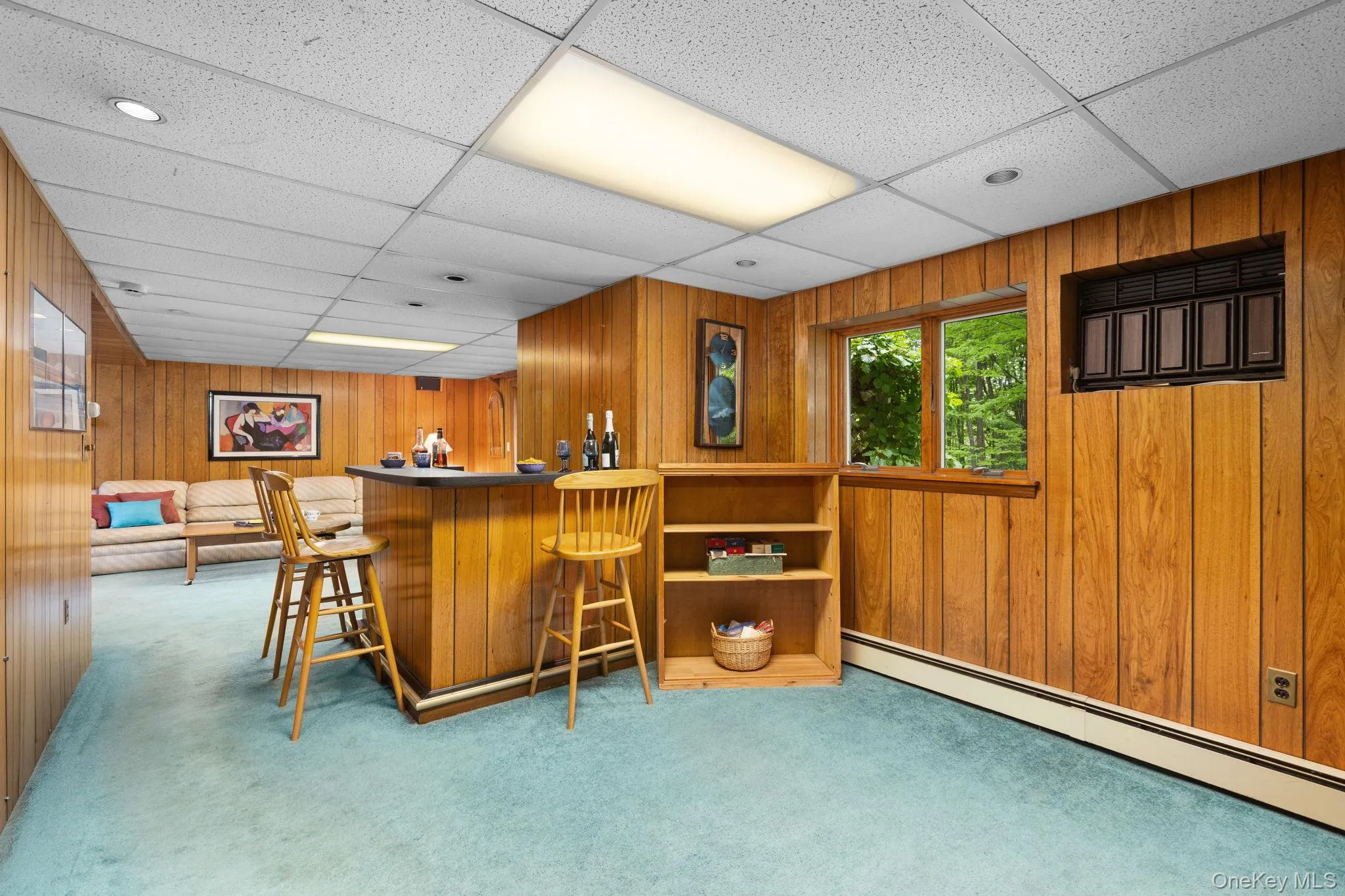 Wall to wall carpet with its refreshment area,, built in shelving and large window Wall to wall carpet with its refreshment area,, built in shelving and large window