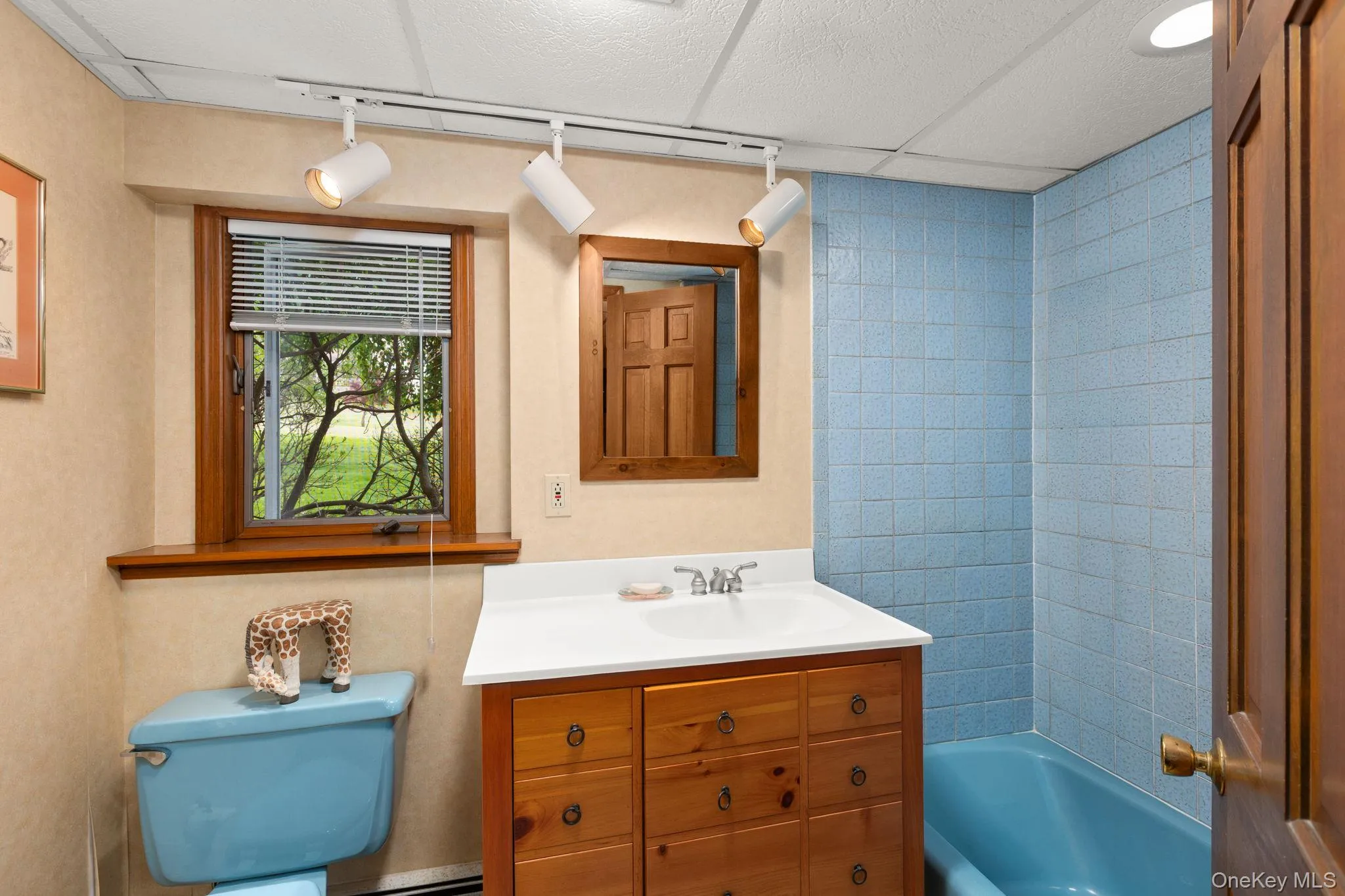 Tile accented shower/tub combo, vanity and task lighting completes the lower level Tile accented shower/tub combo, vanity and task lighting completes the lower level