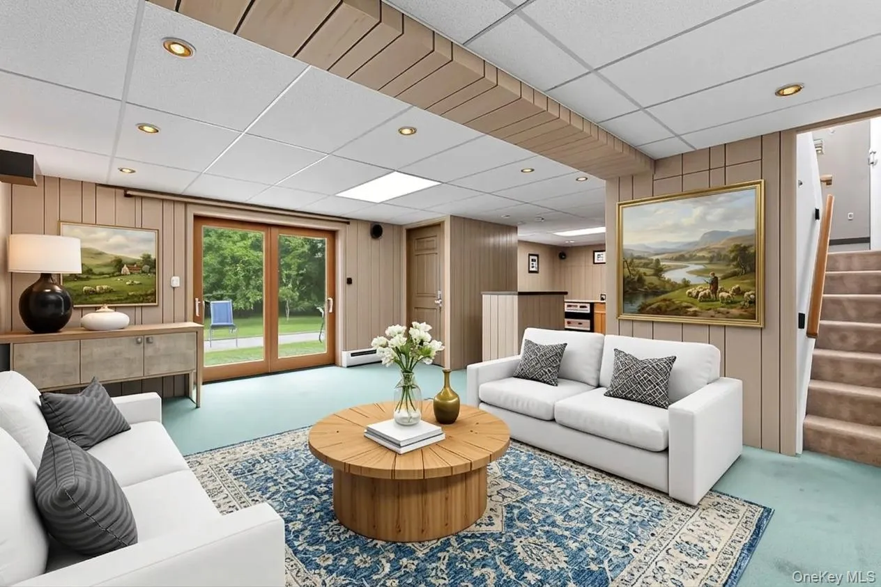 Virtually staged with lighter painted paneling and new furnishings Virtually staged with lighter painted paneling and new furnishings