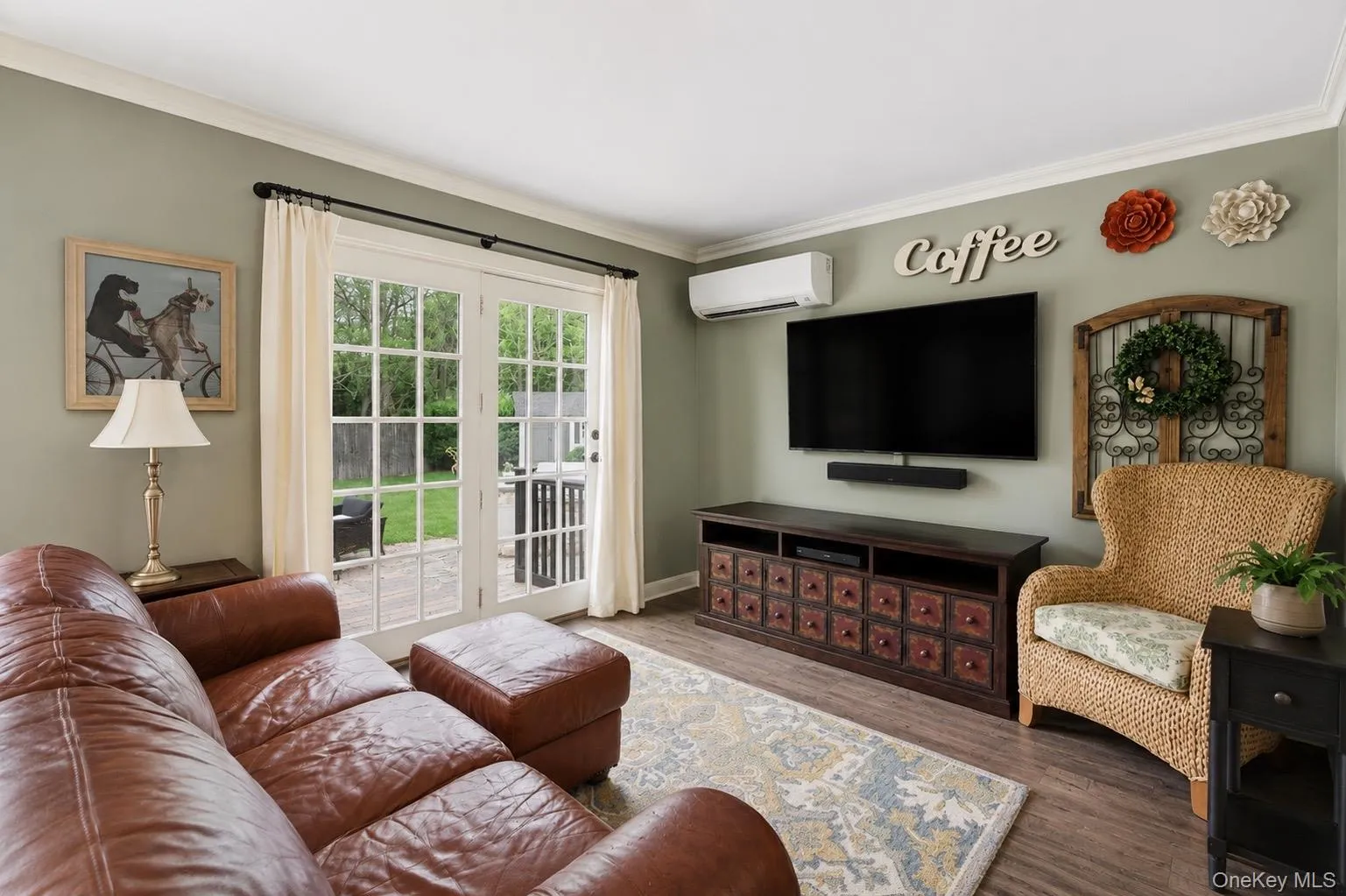 French doors with multiple panes open to an outdoor patio French doors with multiple panes open to an outdoor patio