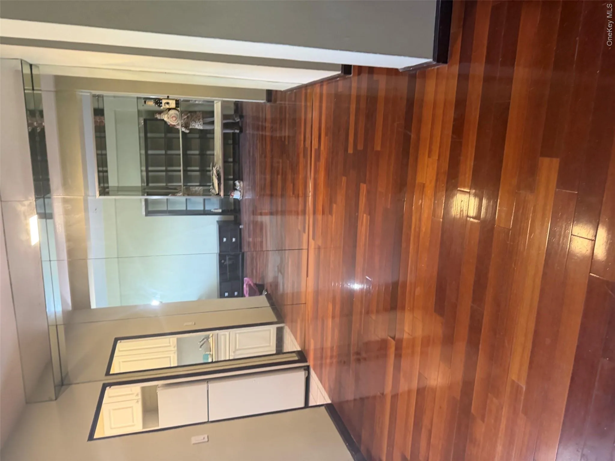 Polished wood-finish flooring extending throughout the space Polished wood-finish flooring extending throughout the space