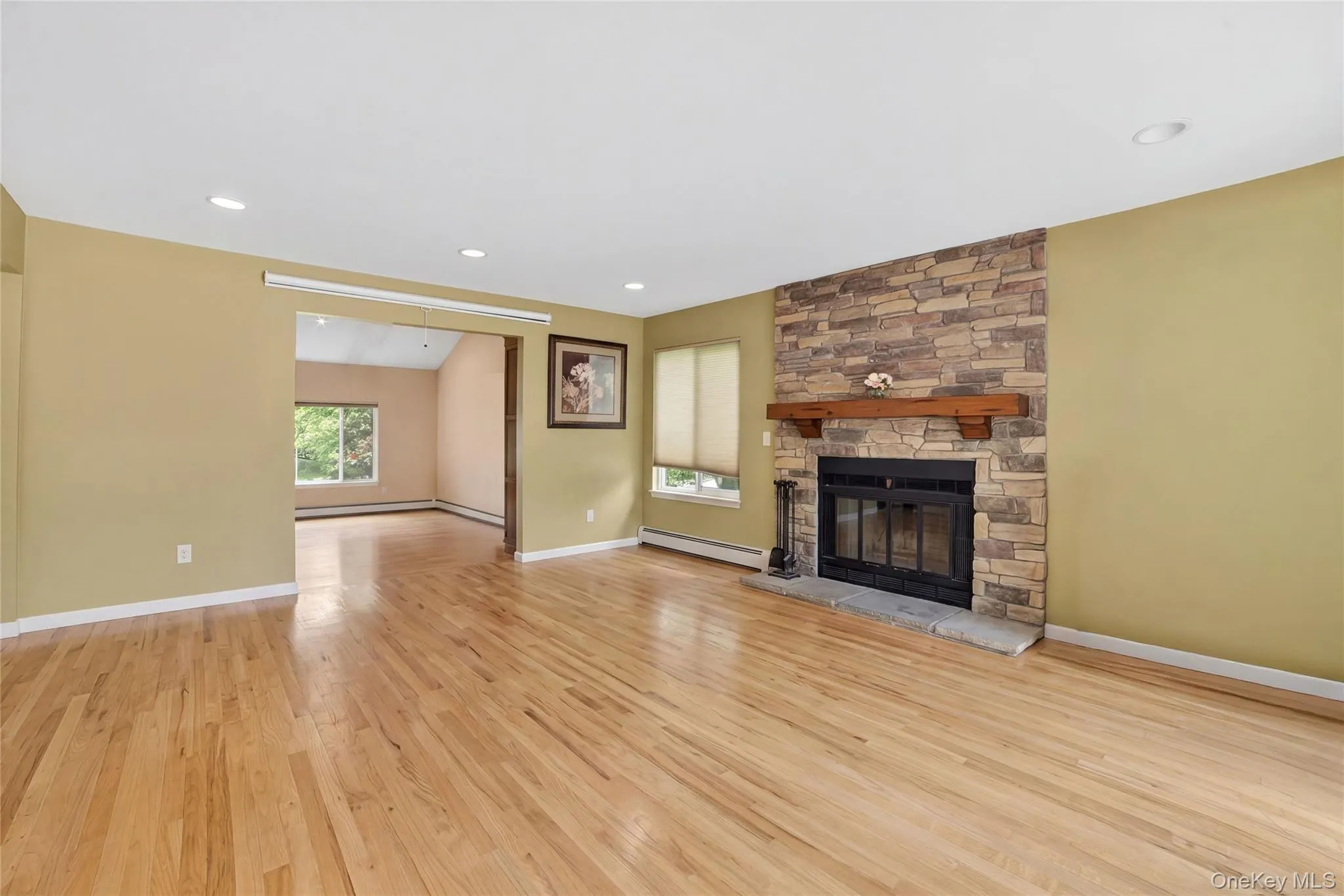 Inviting Family Room with Fireplace and SGD to Deck and Yard Inviting Family Room with Fireplace and SGD to Deck and Yard