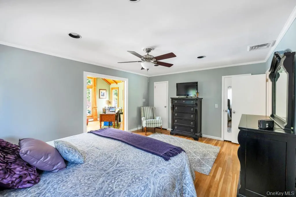Hardwood flooring throughout, recessed lighting, and a ceiling fan Hardwood flooring throughout, recessed lighting, and a ceiling fan