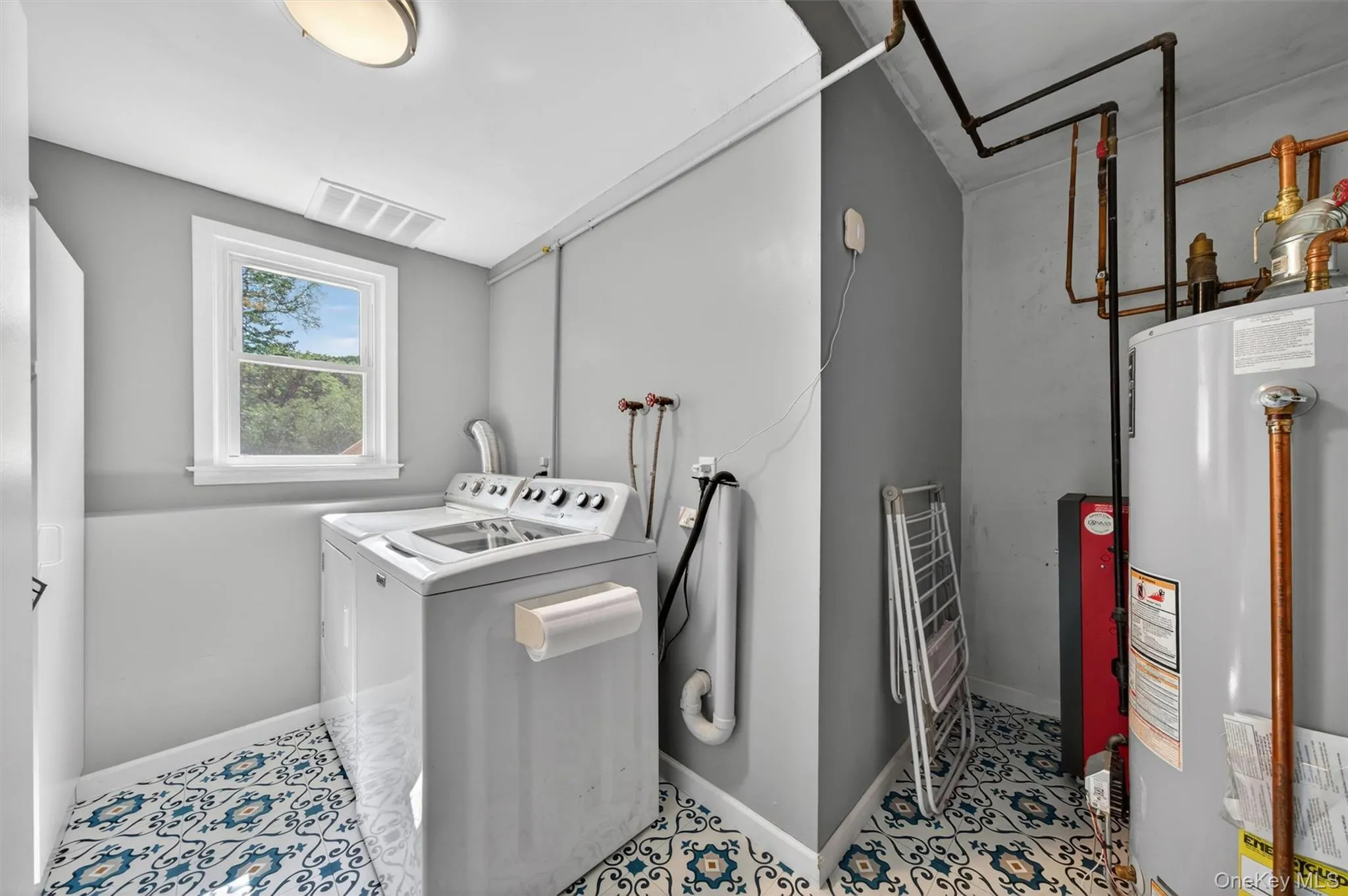 The laundry room has storage to the left and new floors. The laundry room has storage to the left and new floors.