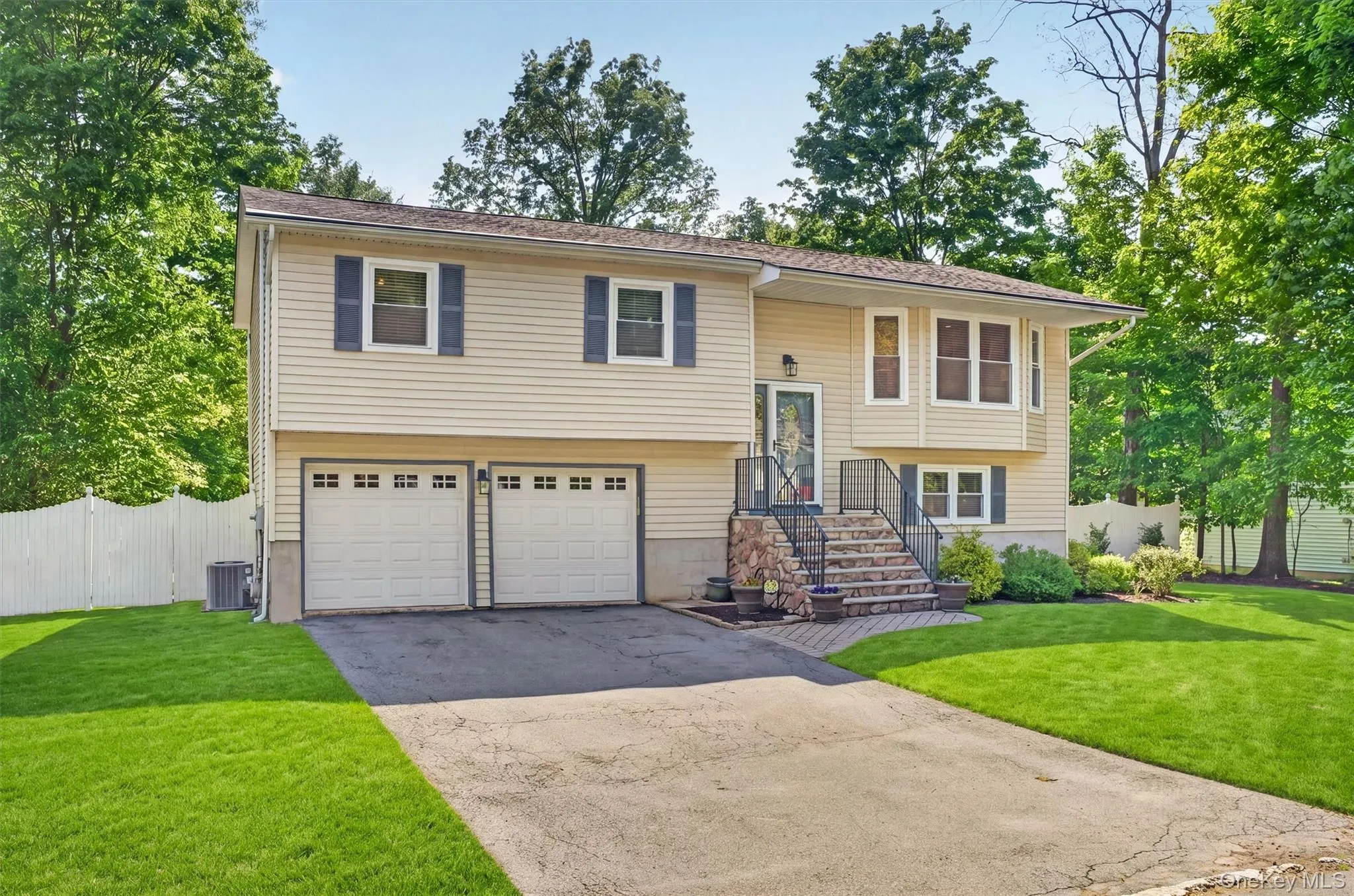 The driveway can easily fit 4 more cars. The driveway can easily fit 4 more cars.