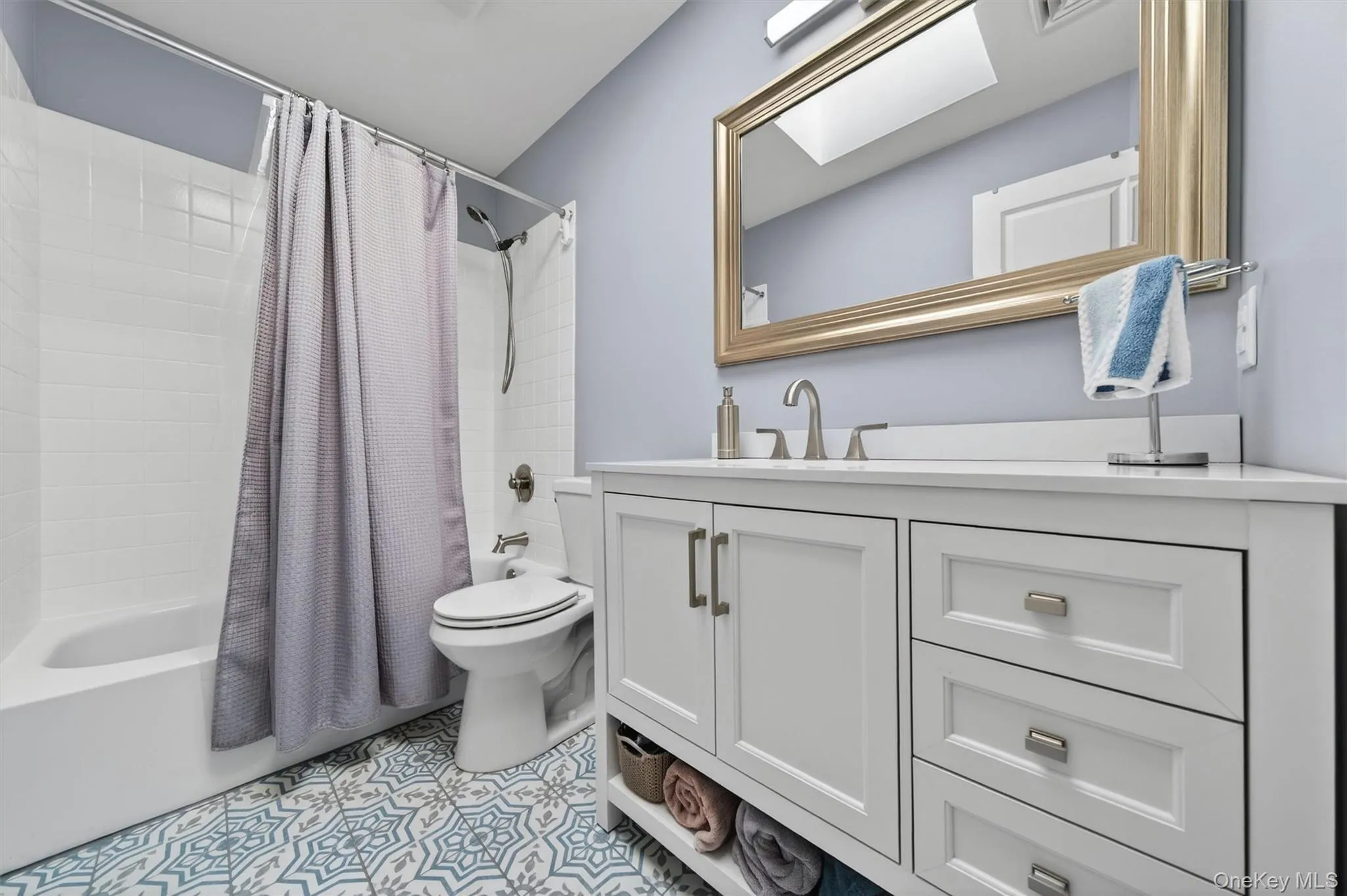 The full guest bath has a skylight above and designer tile floor. The full guest bath has a skylight above and designer tile floor.