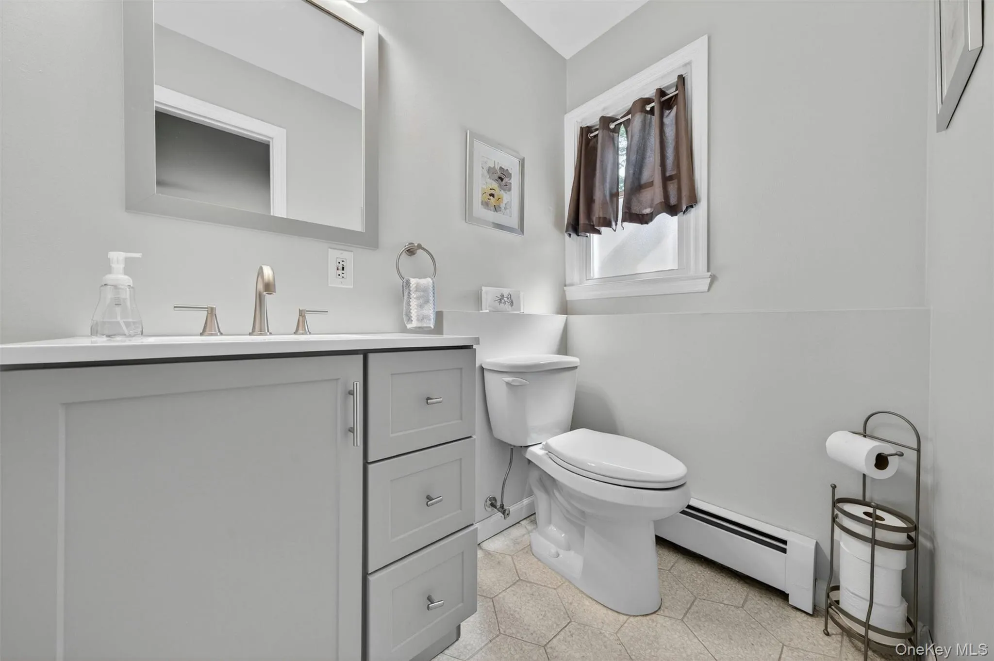 The half bath downstairs is perfect to access from the sliders. The half bath downstairs is perfect to access from the sliders.