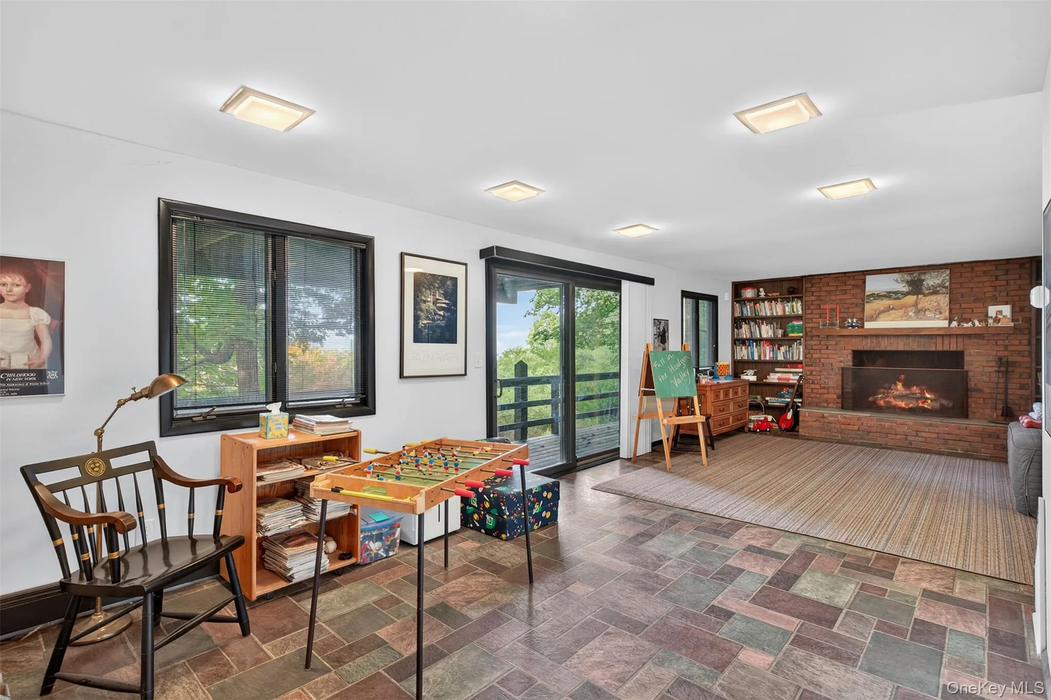 Family Room is located on the ground floor, with sliders out to the lower deck and stairs that lead down to backyard Family Room is located on the ground floor, with sliders out to the lower deck and stairs that lead down to backyard
