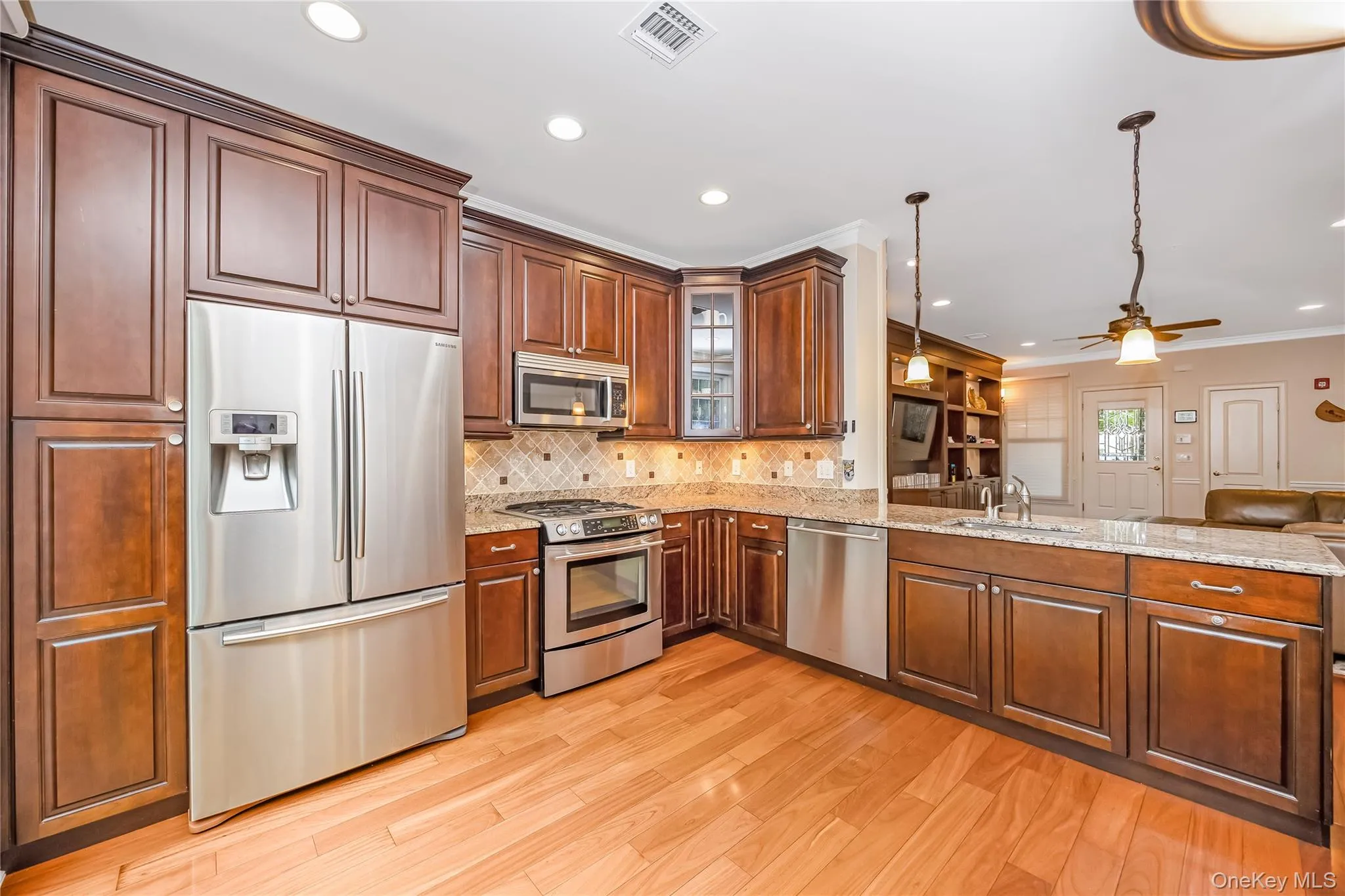 EIK with wood cabinets, granite counter tops, ss appliances and sliders to the private patio EIK with wood cabinets, granite counter tops, ss appliances and sliders to the private patio