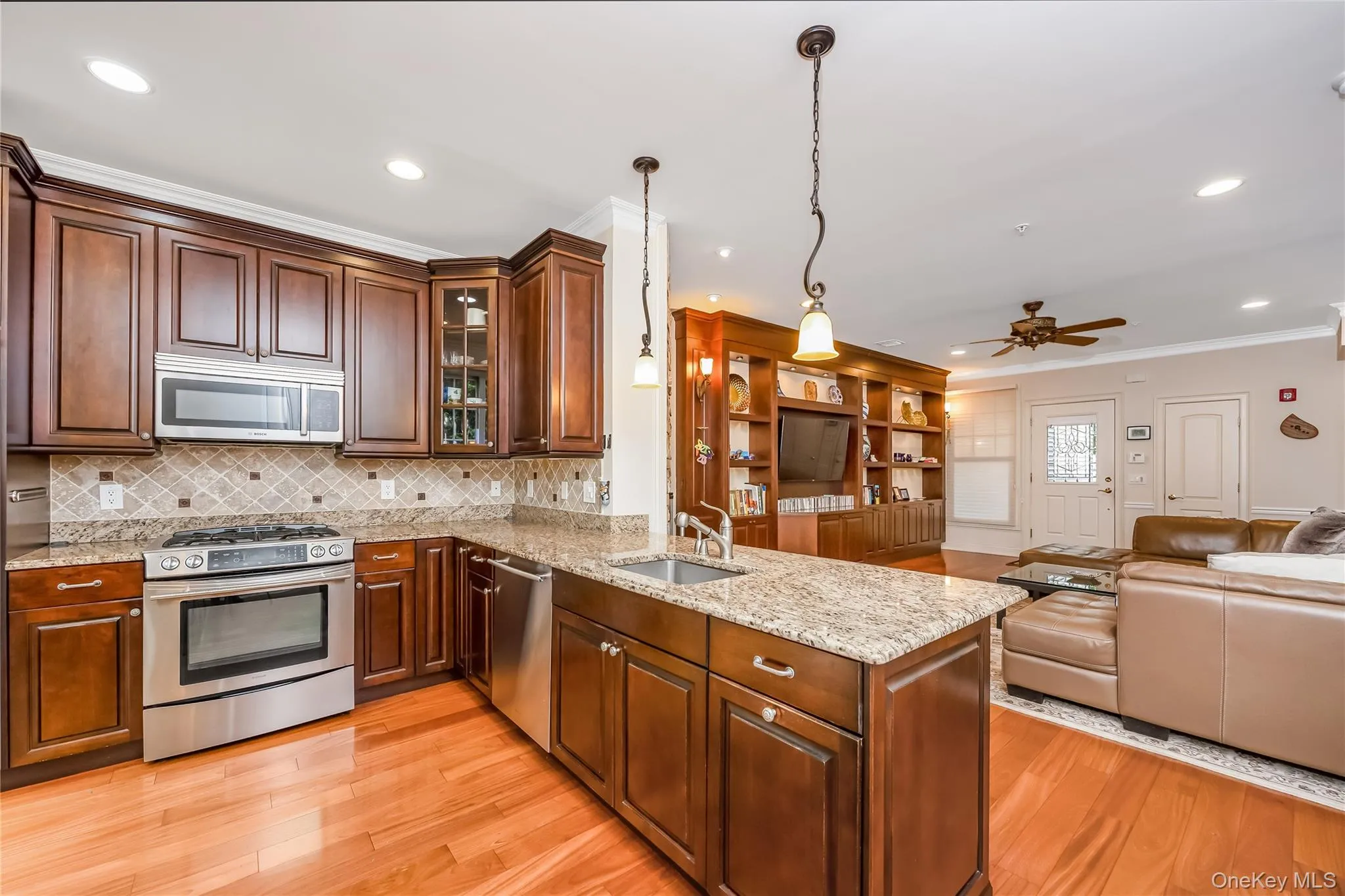 EIK with wood cabinets, granite counter tops, ss appliances and sliders to the private patio EIK with wood cabinets, granite counter tops, ss appliances and sliders to the private patio
