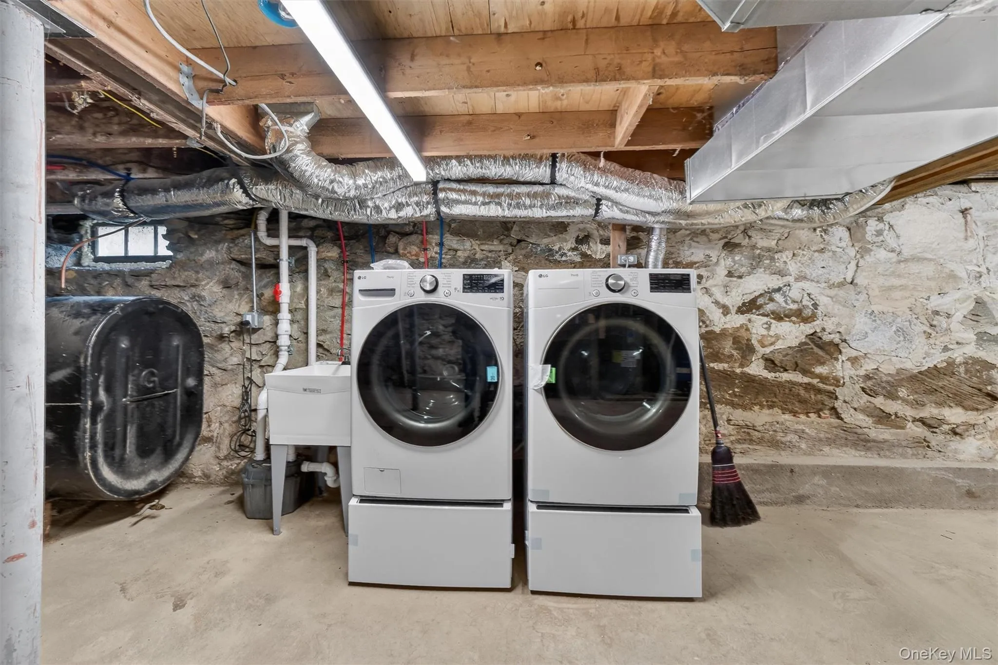 Brand-new washer & dryer in unfinished basement. Brand-new washer & dryer in unfinished basement.