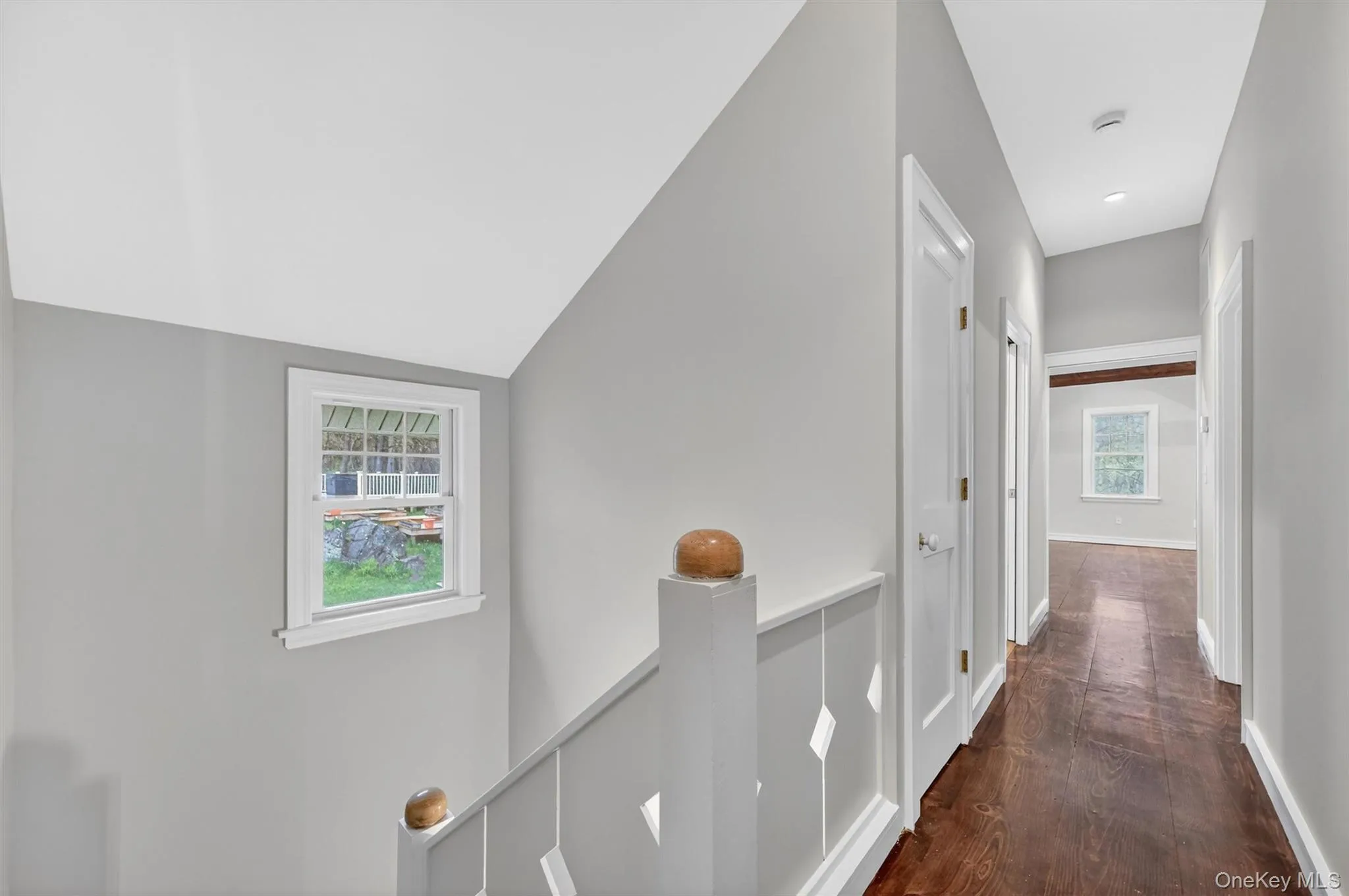 Upstairs hallway - hardwood floors consistent throughout the home. Upstairs hallway - hardwood floors consistent throughout the home.