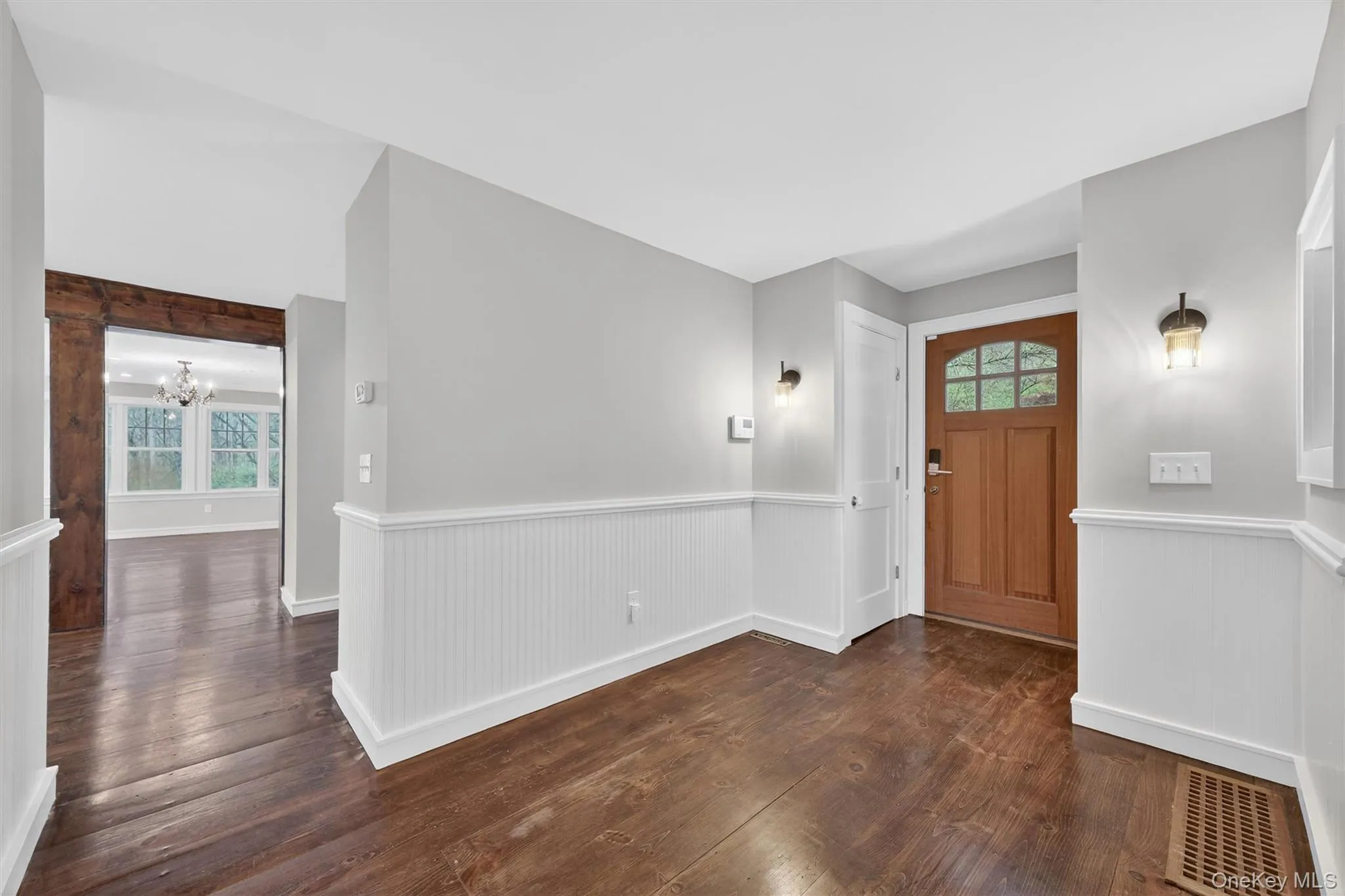 Entryway connects the formal living room, powder room, staircases, & kitchen/dining area. Entryway connects the formal living room, powder room, staircases, & kitchen/dining area.