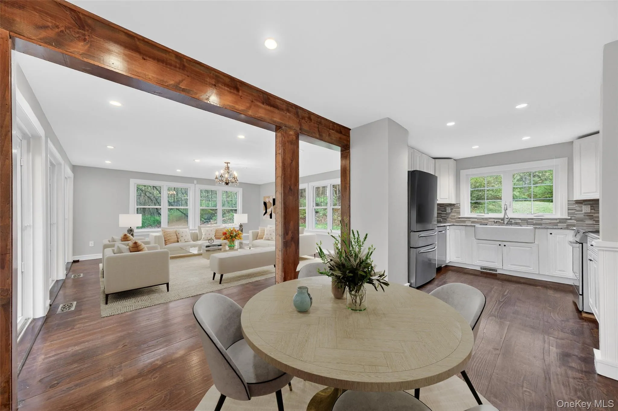Virtually staged dining room, kitchen, & living room. Virtually staged dining room, kitchen, & living room.