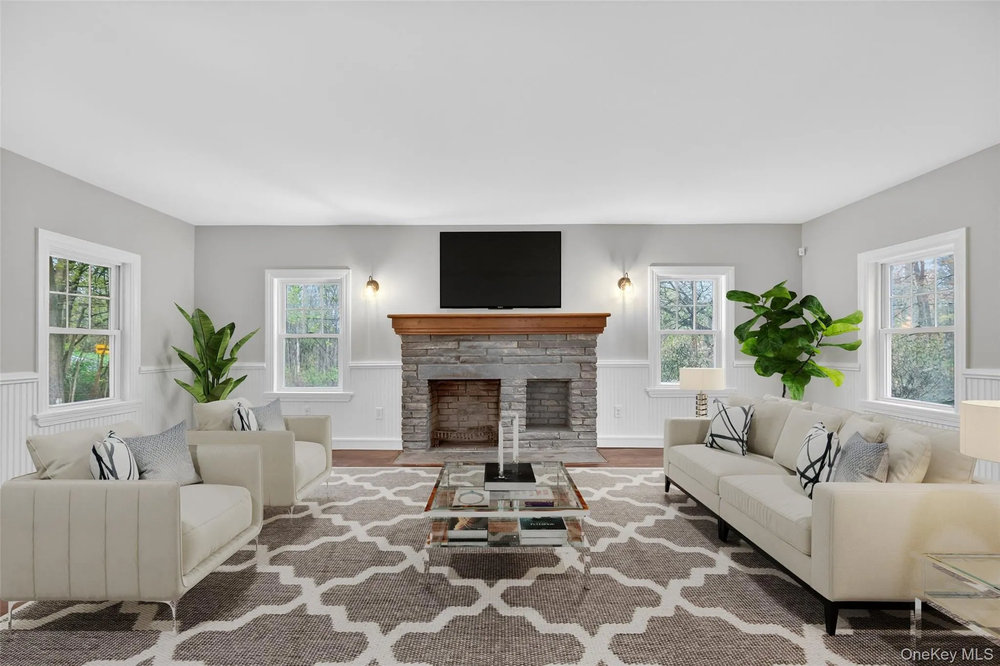 Virtually staged formal living room w/ decorative fireplace. Virtually staged formal living room w/ decorative fireplace.