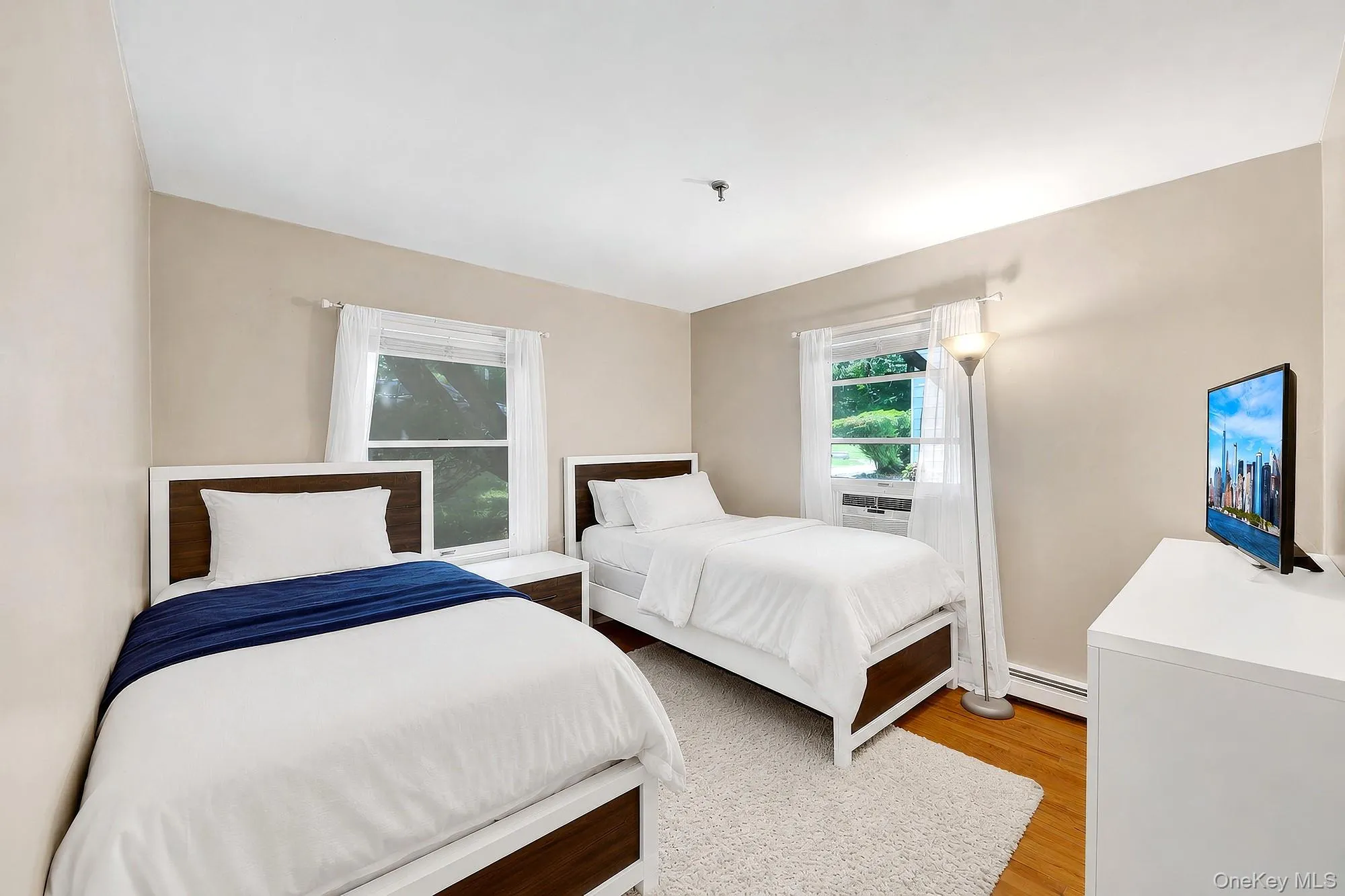 Third bedroom with hardwood floors and large closet Third bedroom with hardwood floors and large closet