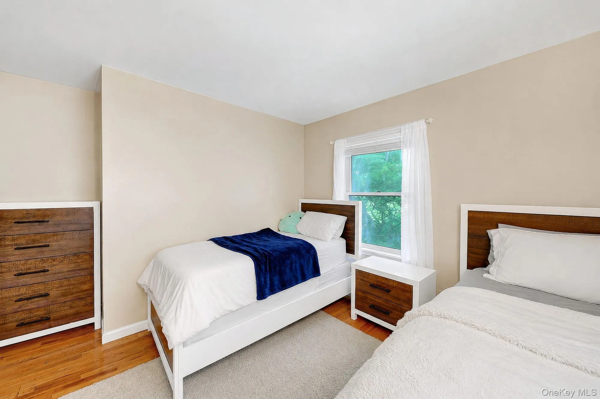 Third bedroom with hardwood floors and large closet Third bedroom with hardwood floors and large closet