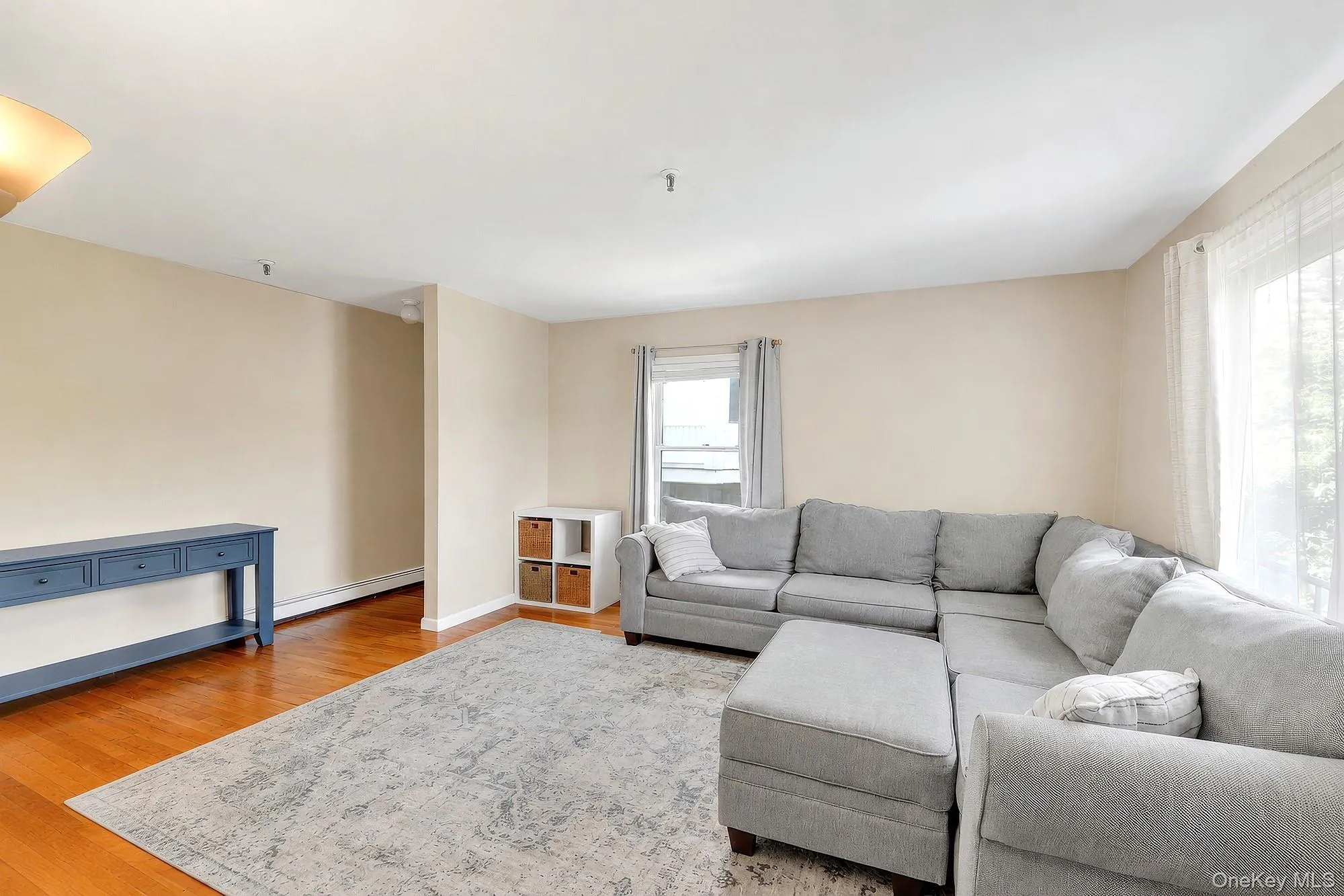 Large living room with double exposure and hardwood floors Large living room with double exposure and hardwood floors