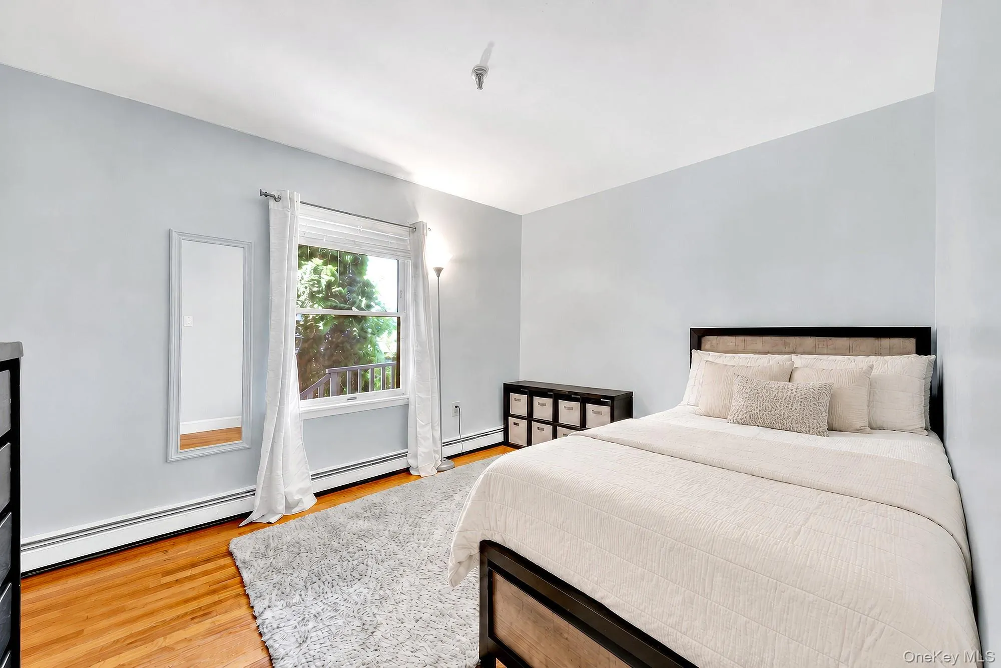 Second bedroom with hardwood floors and large closet Second bedroom with hardwood floors and large closet