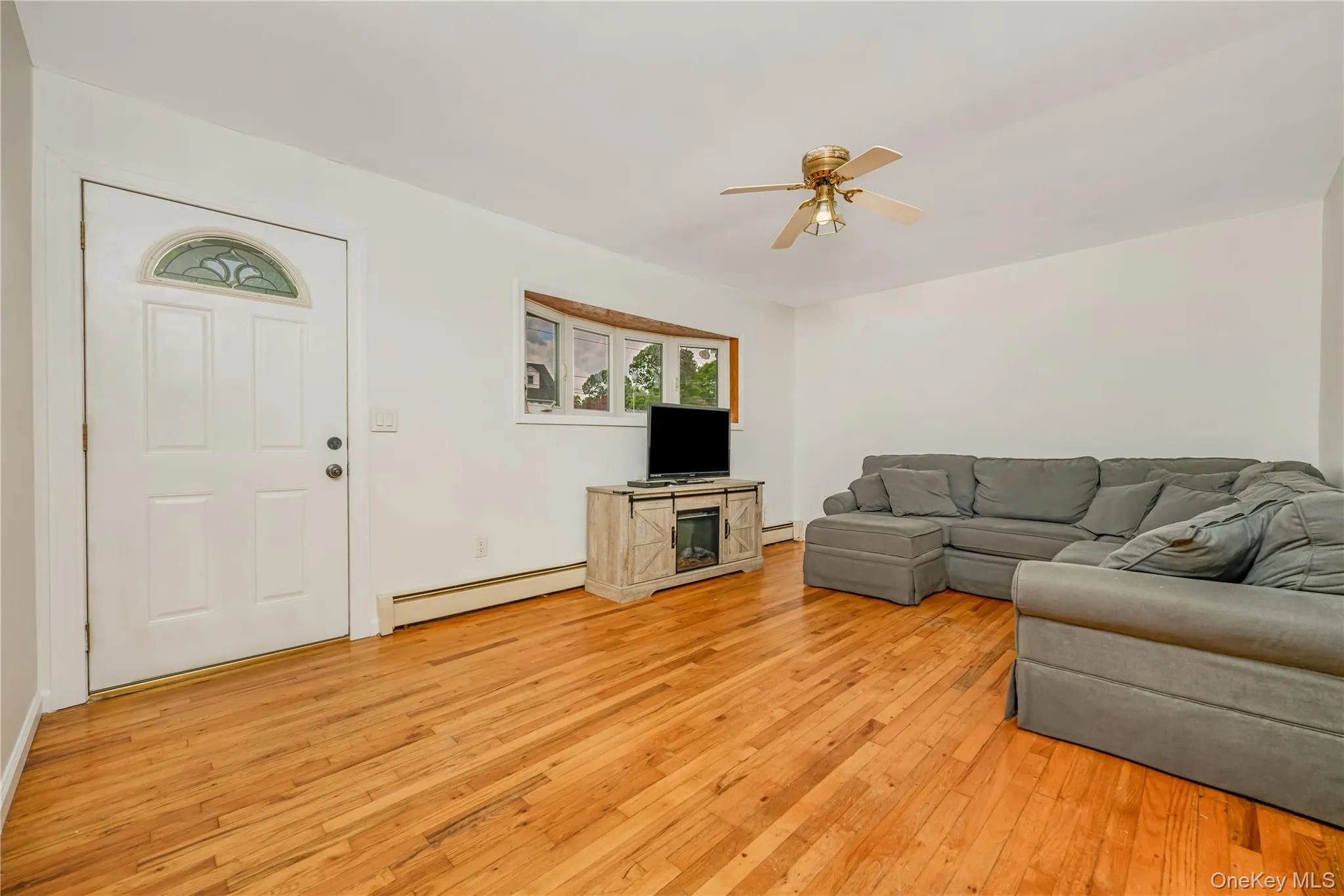 Hardwood flooring throughout this living space Hardwood flooring throughout this living space