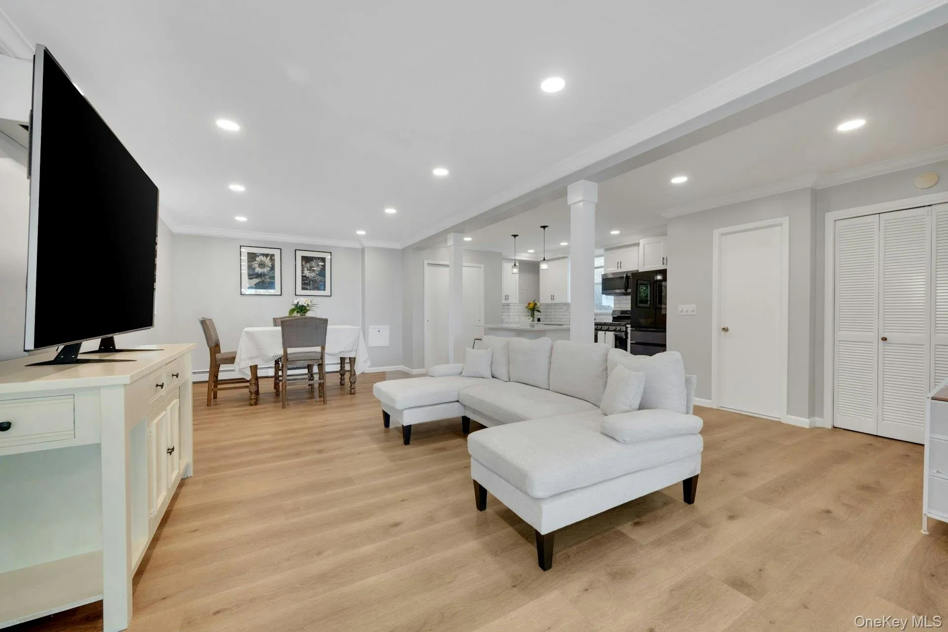 Living room with recessed lights and new flooring Living room with recessed lights and new flooring
