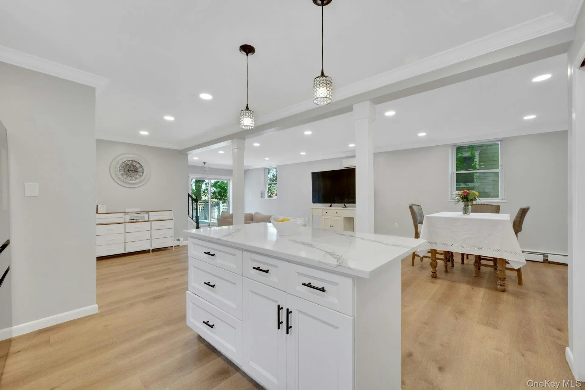 Remodeled kitchen showing the beautiful pendant lighting and center island Remodeled kitchen showing the beautiful pendant lighting and center island