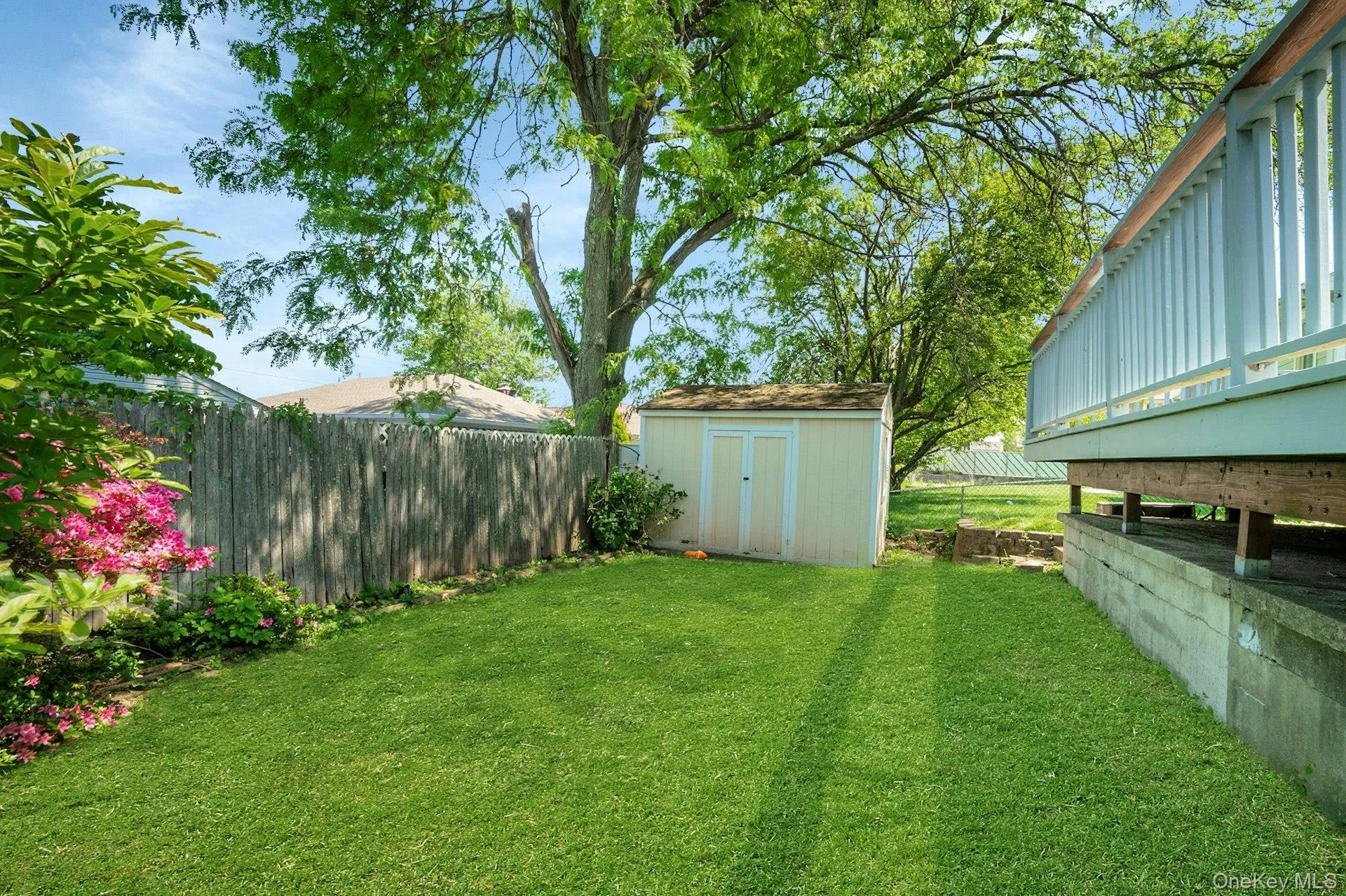 Another view of the yard showing the large storage shed Another view of the yard showing the large storage shed
