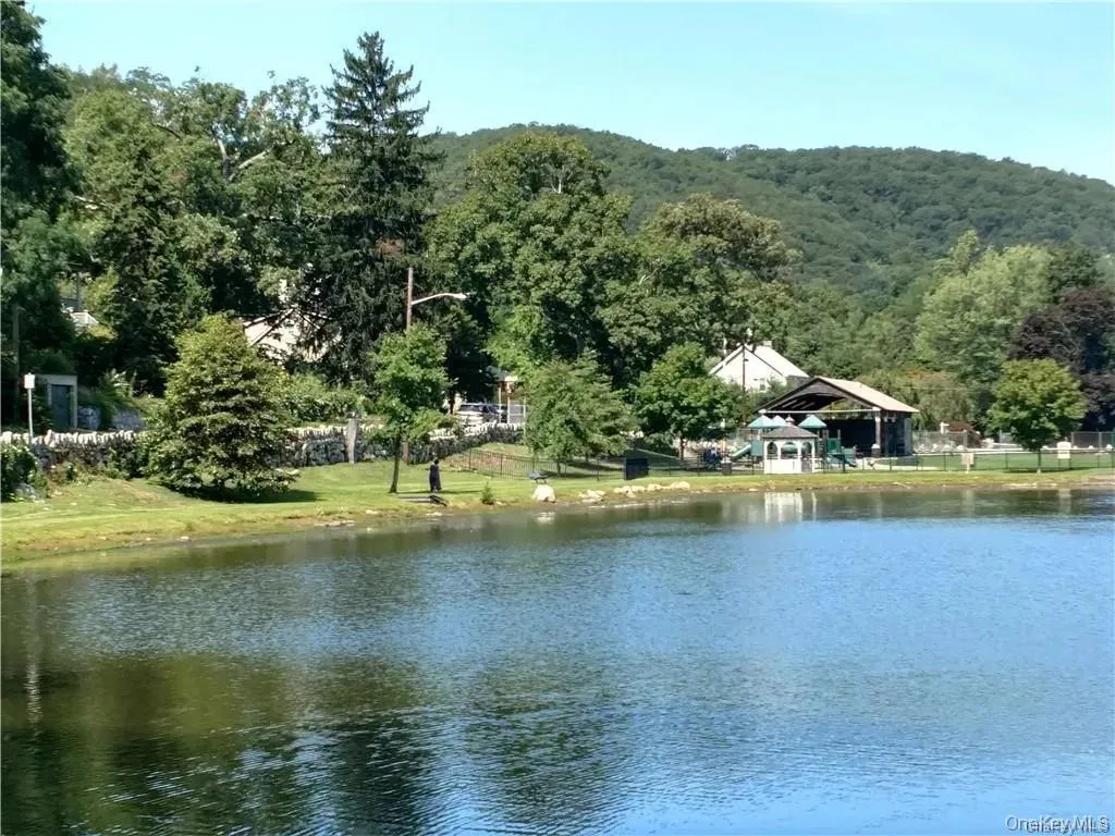 Property view of water with a gazebo and a view of trees Property view of water with a gazebo and a view of trees
