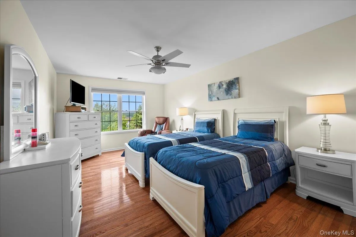 Upstairs Bedroom with Walk-In Closet and Hardwood Floors Upstairs Bedroom with Walk-In Closet and Hardwood Floors