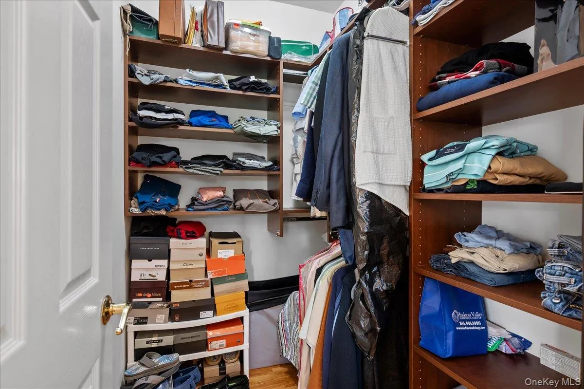 His and Hers Walk-In-Closet with Organizers His and Hers Walk-In-Closet with Organizers