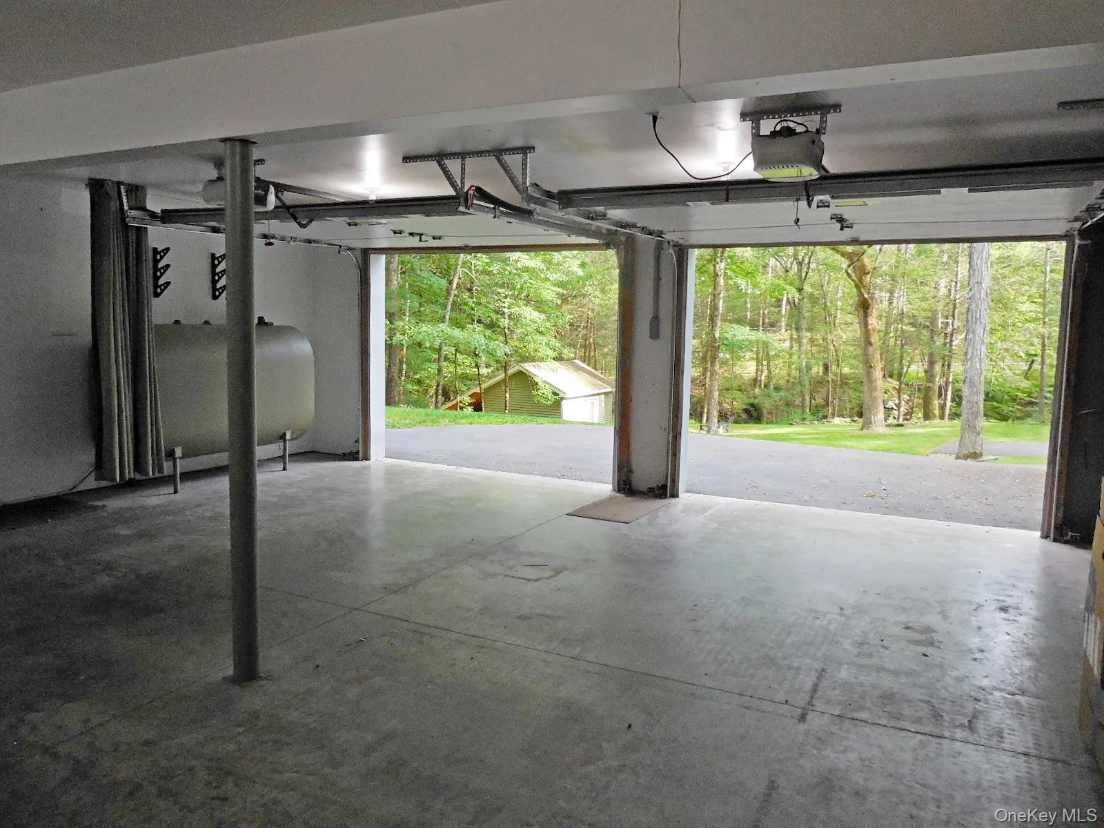 Large 2 car garage, automatic openers and EV Charger. Large 2 car garage, automatic openers and EV Charger.