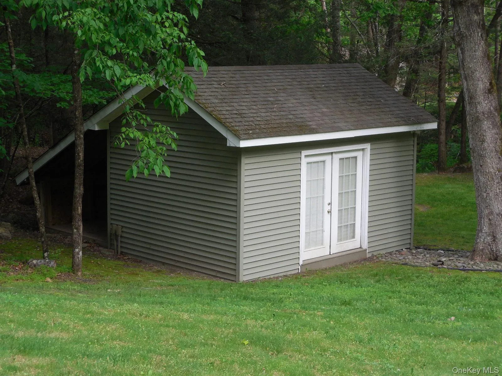 Ample storage shed w/ double doors and electric. Ample storage shed w/ double doors and electric.