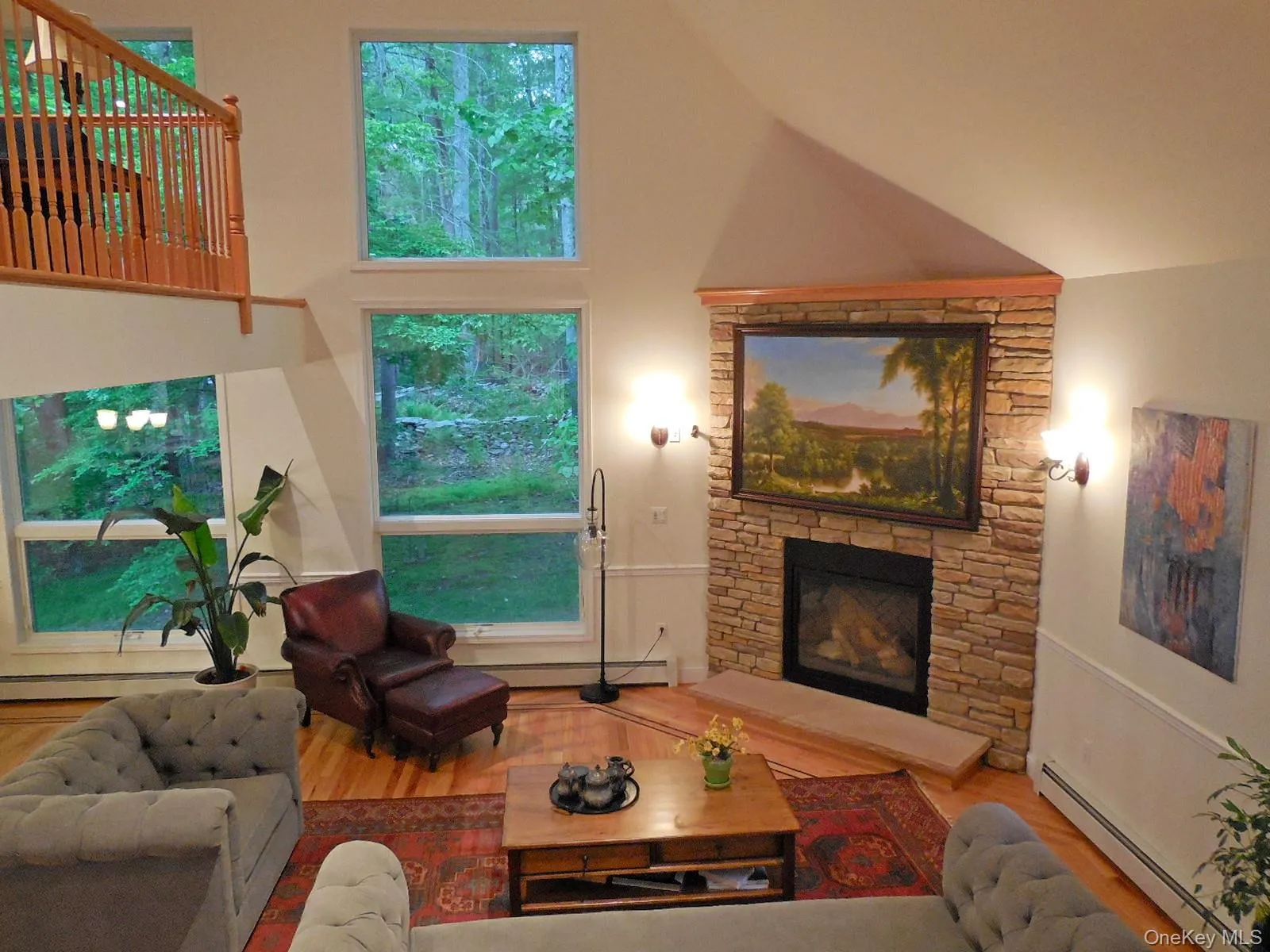 Open airy livingroom, stone fpl, inlaid wdwd floors & beautiful oversized floor to ceiling windows Open airy livingroom, stone fpl, inlaid wdwd floors & beautiful oversized floor to ceiling windows