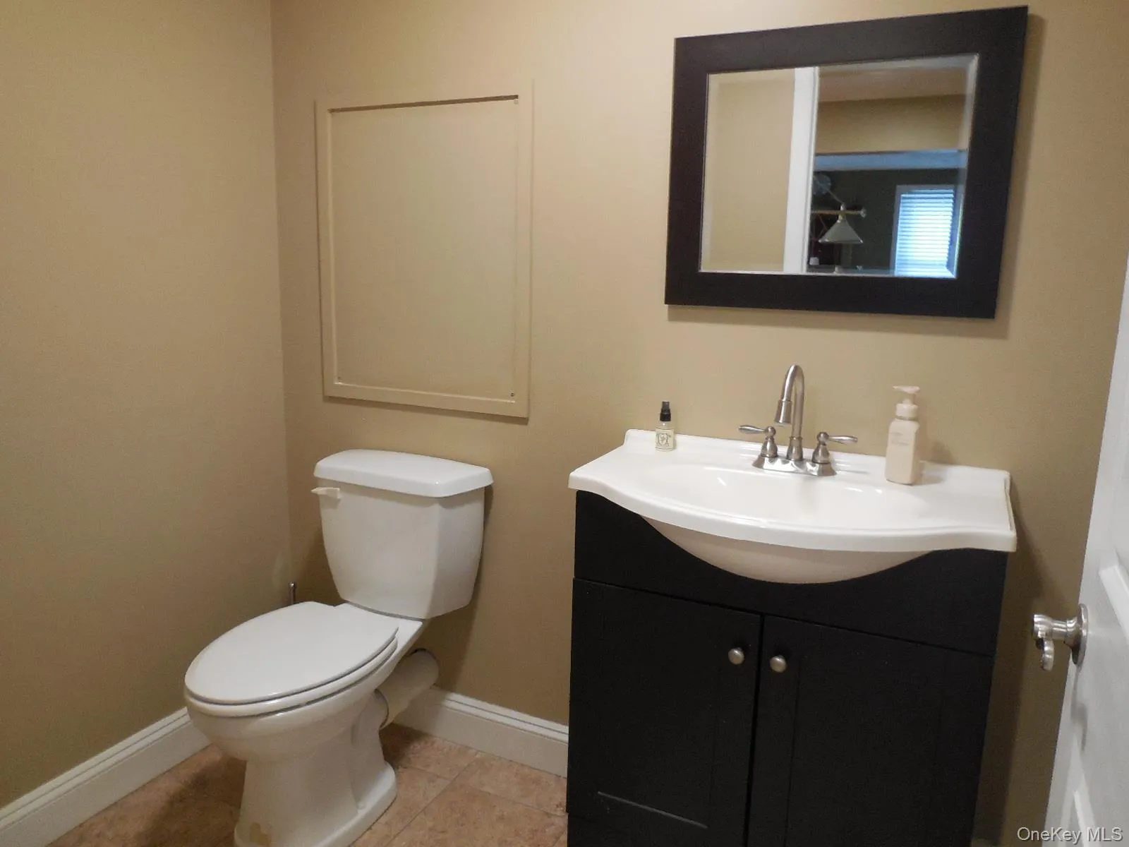 Lower level half bath off the recreation room. Lower level half bath off the recreation room.