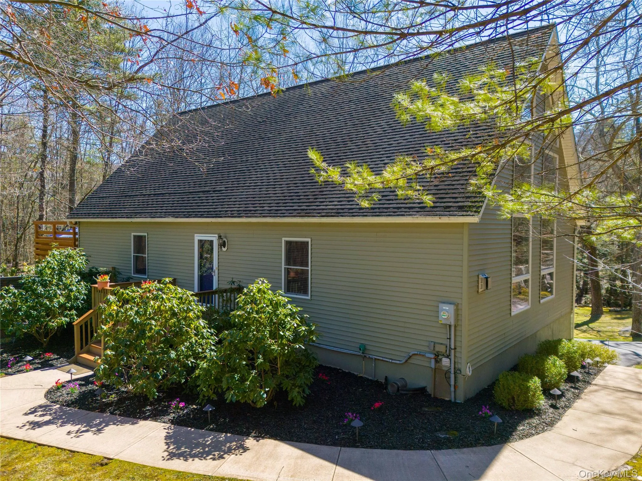 Landscapped entry, small front porch, sidewalk wraps around side of home to driveway. Landscapped entry, small front porch, sidewalk wraps around side of home to driveway.