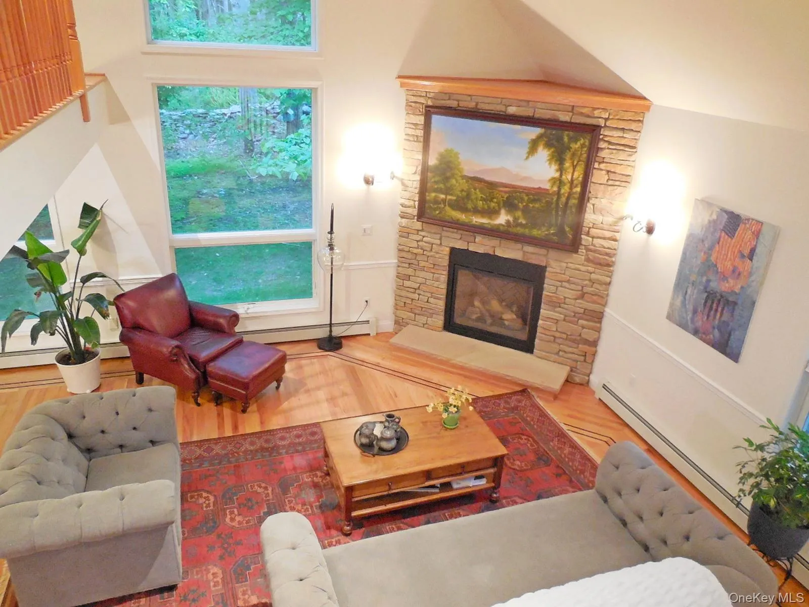 Open livingroom, stone fpl, inlaid wdwd floors & beautiful oversized floor to ceiling windows Open livingroom, stone fpl, inlaid wdwd floors & beautiful oversized floor to ceiling windows