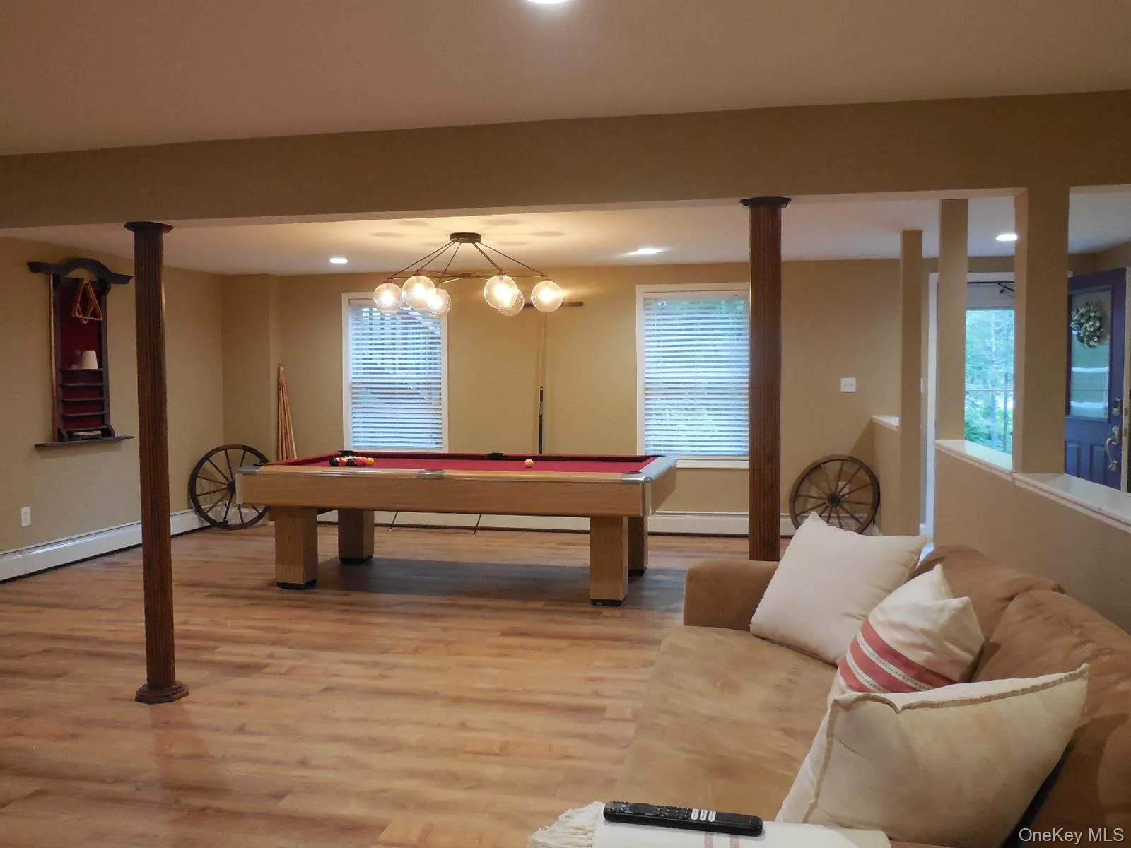 Large 670 SF Recreation room w separate entry, half bath & closet. Utility rm, 2 car garage & stairs to main level to the right of photo. Large 670 SF Recreation room w separate entry, half bath & closet. Utility rm, 2 car garage & stairs to main level to the right of photo.