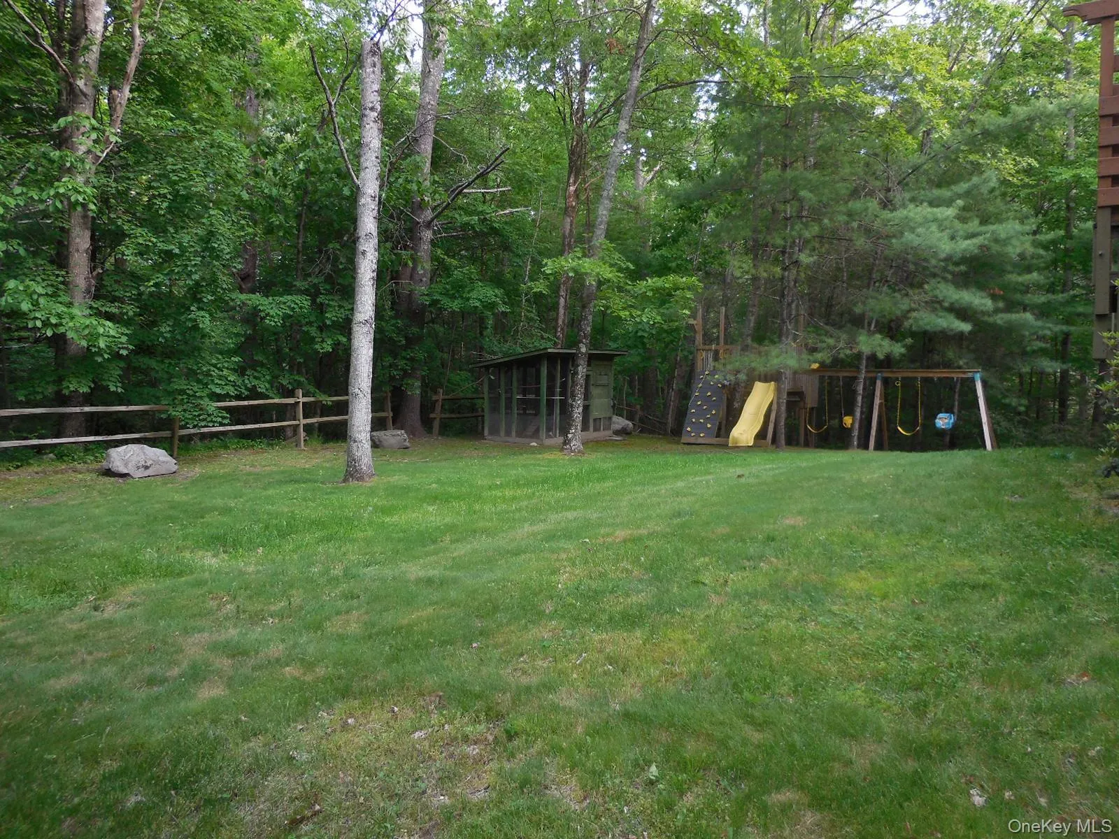 Play area in side yard. Play area in side yard.
