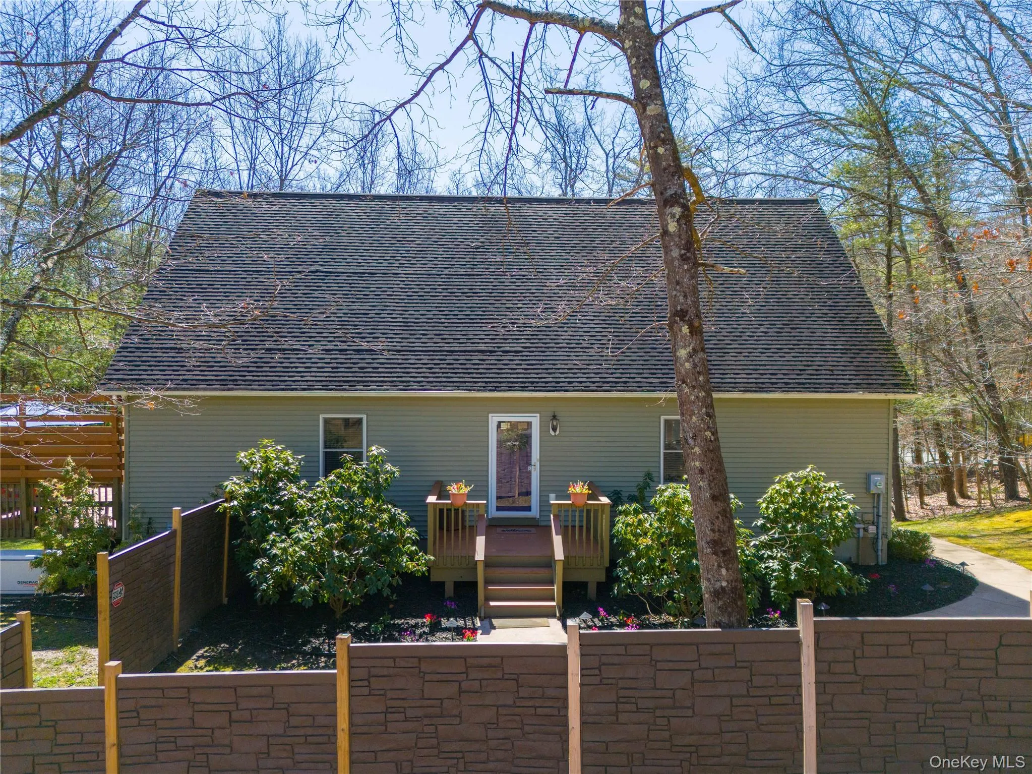 Sweetly landscaped w eco tech fencing creating a desirable front courtyard. Sweetly landscaped w eco tech fencing creating a desirable front courtyard.
