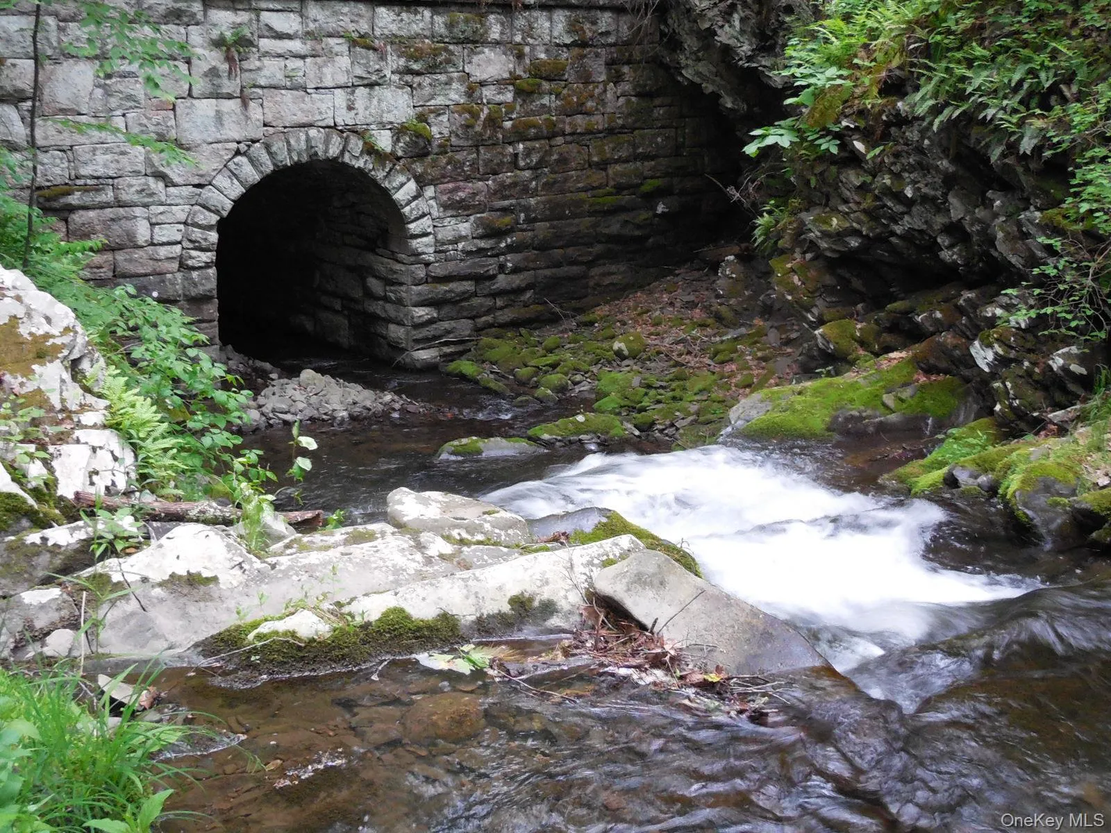 View of second cascading falls leading to tunnel. View of second cascading falls leading to tunnel.