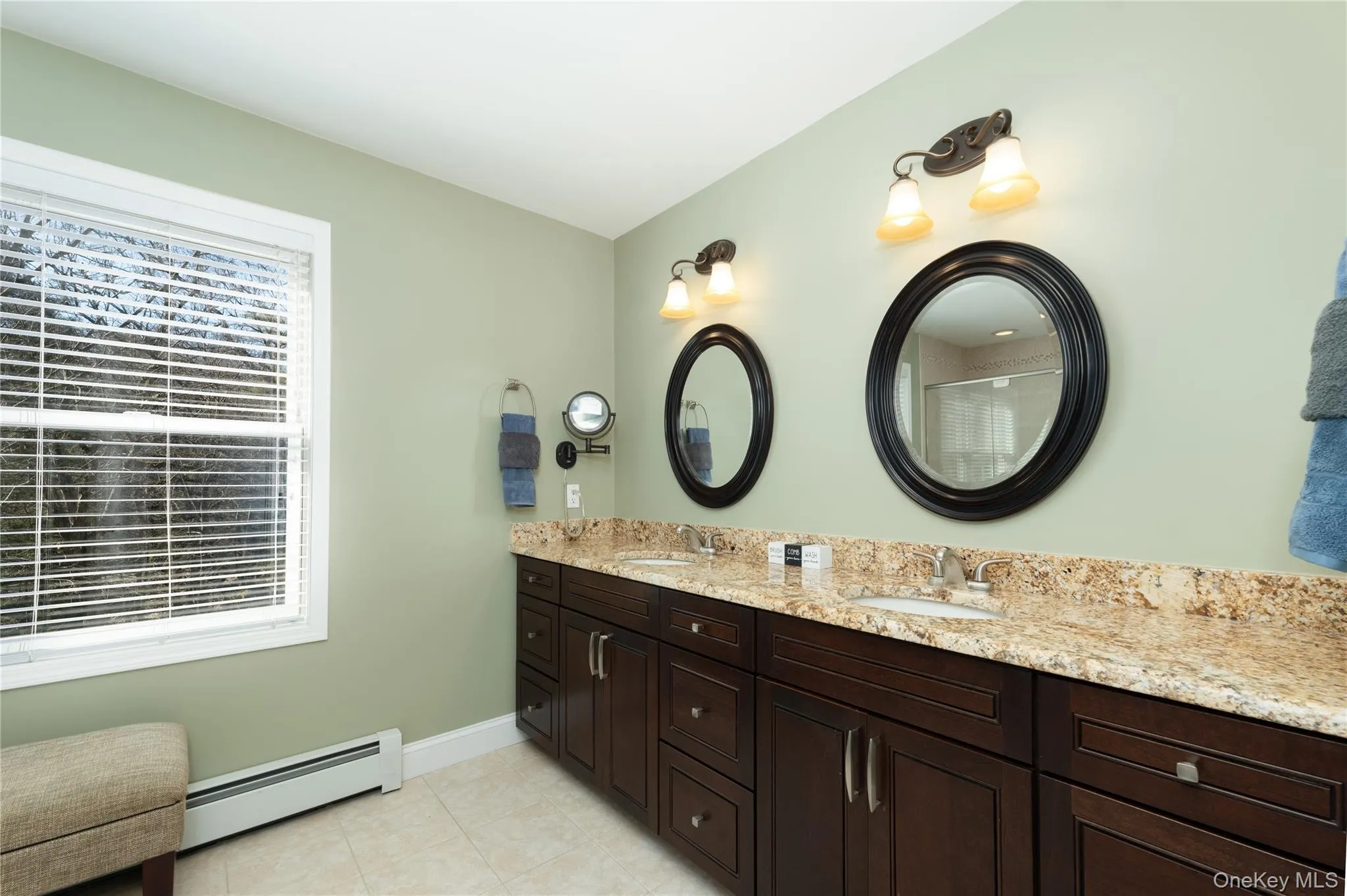 Huge primary bath, dual vanity, granite vanity top, oversized double windows, tile floor. Huge primary bath, dual vanity, granite vanity top, oversized double windows, tile floor.