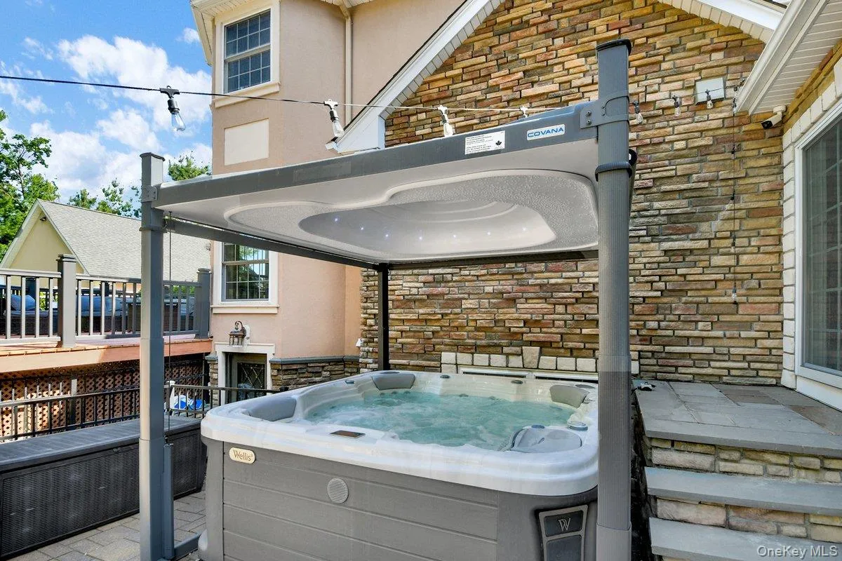 Wellis Hot Tub is Covana Motorized Top w. LED Lights / Speaker System Wellis Hot Tub is Covana Motorized Top w. LED Lights / Speaker System