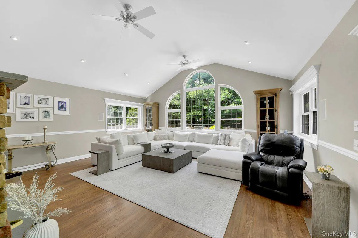 Spacious Great Room Dramatic Arched Windows Overlooking the Pool Spacious Great Room Dramatic Arched Windows Overlooking the Pool