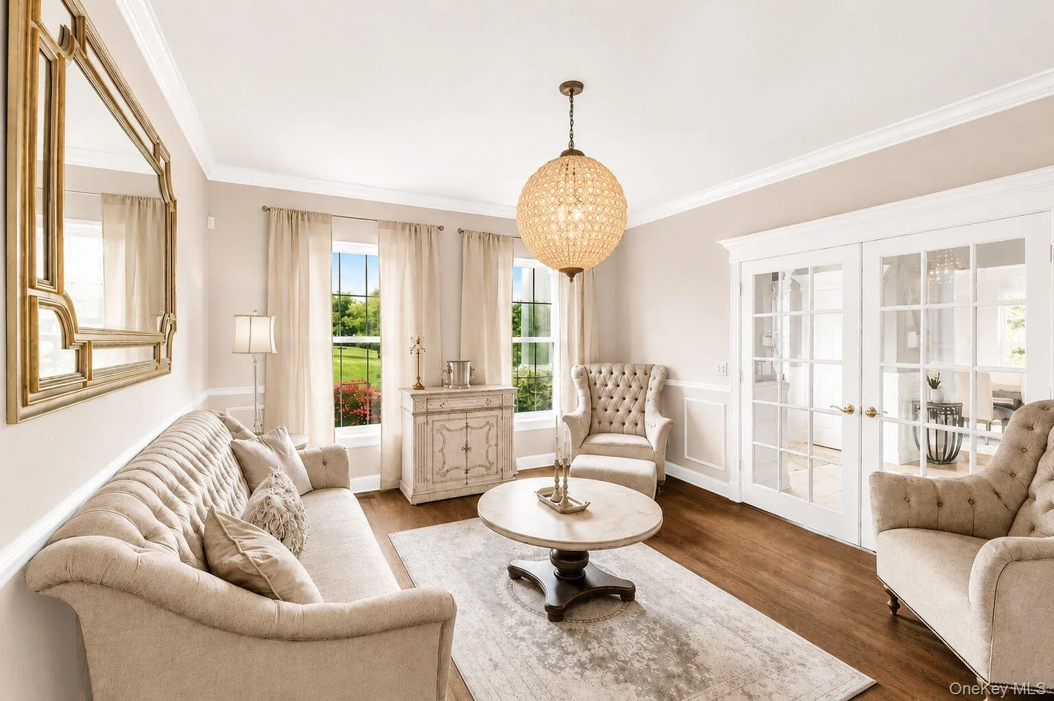 Formal Living Room w. French Doors to Entrance, Hardwood Floors & Arhaus Chandelier Formal Living Room w. French Doors to Entrance, Hardwood Floors & Arhaus Chandelier