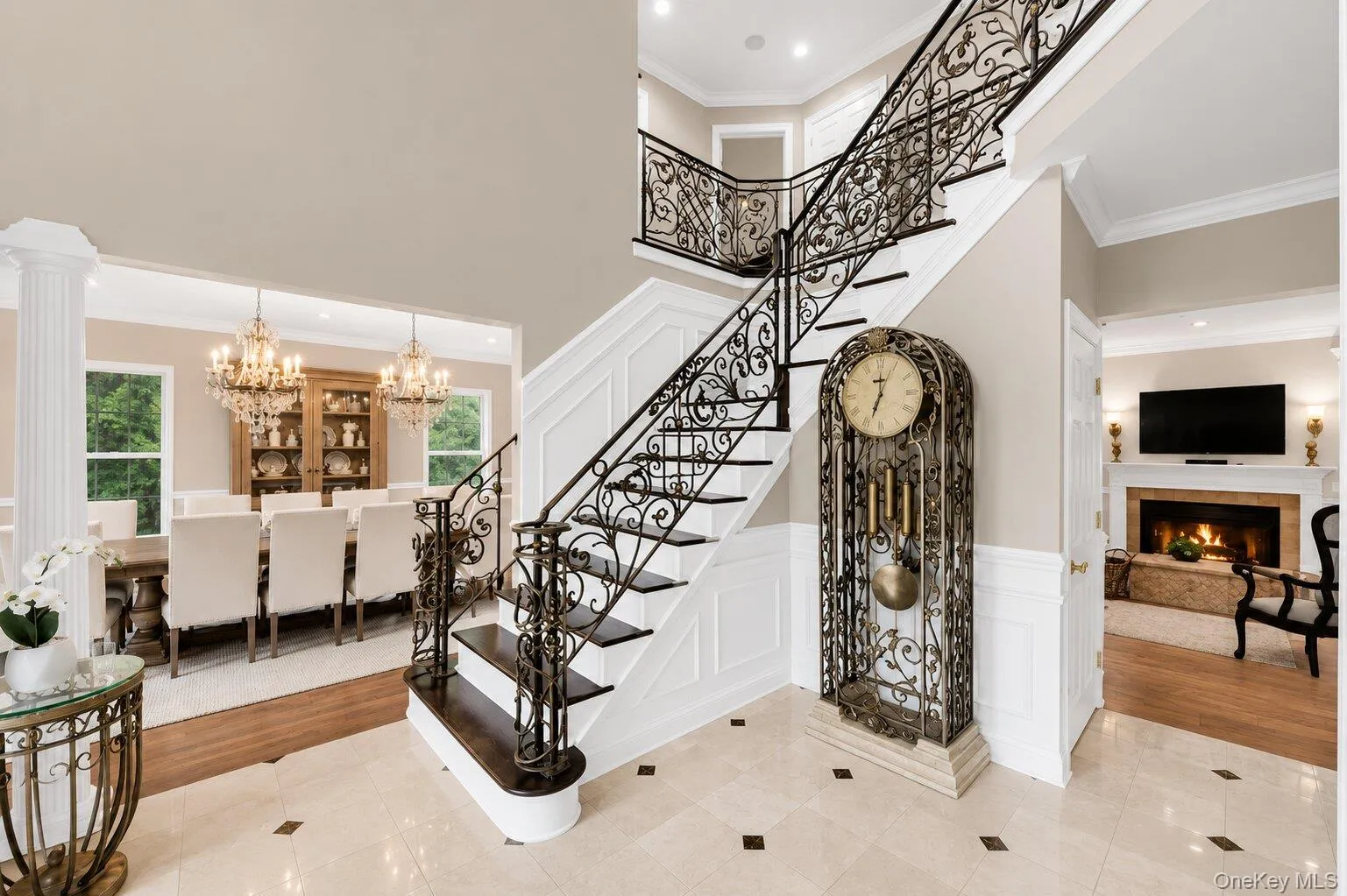 Inviting Entrance w. Formal Dining to the left / Formal Living Room to the right / View of Library w. Fireplace Inviting Entrance w. Formal Dining to the left / Formal Living Room to the right / View of Library w. Fireplace