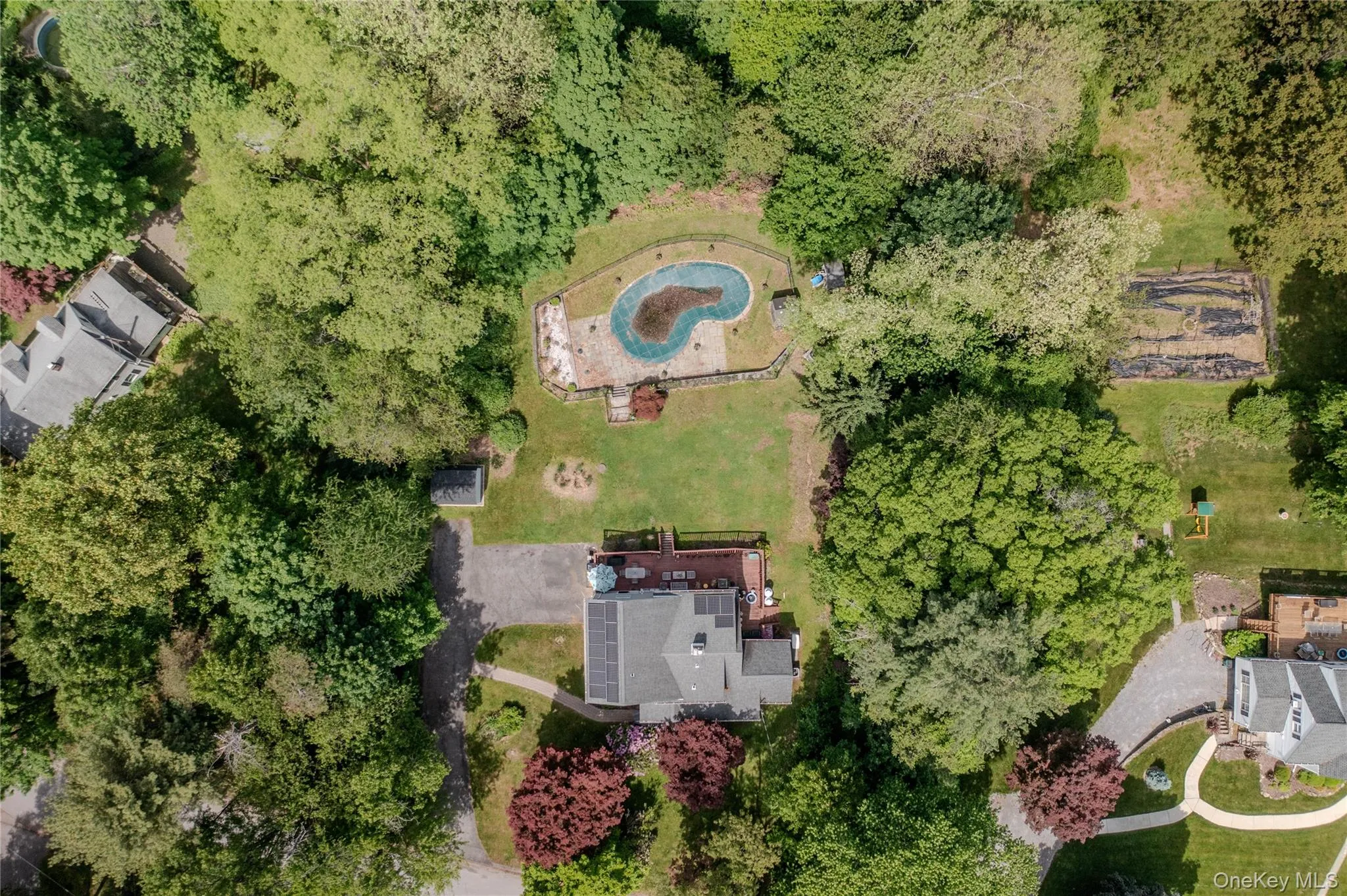 Deck overlooks pool in a private setting Deck overlooks pool in a private setting
