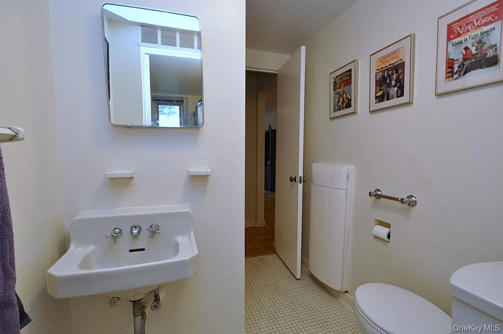 Half bath has access from both the hall and primary bedroom via the full bath. View 2 Half bath has access from both the hall and primary bedroom via the full bath. View 2