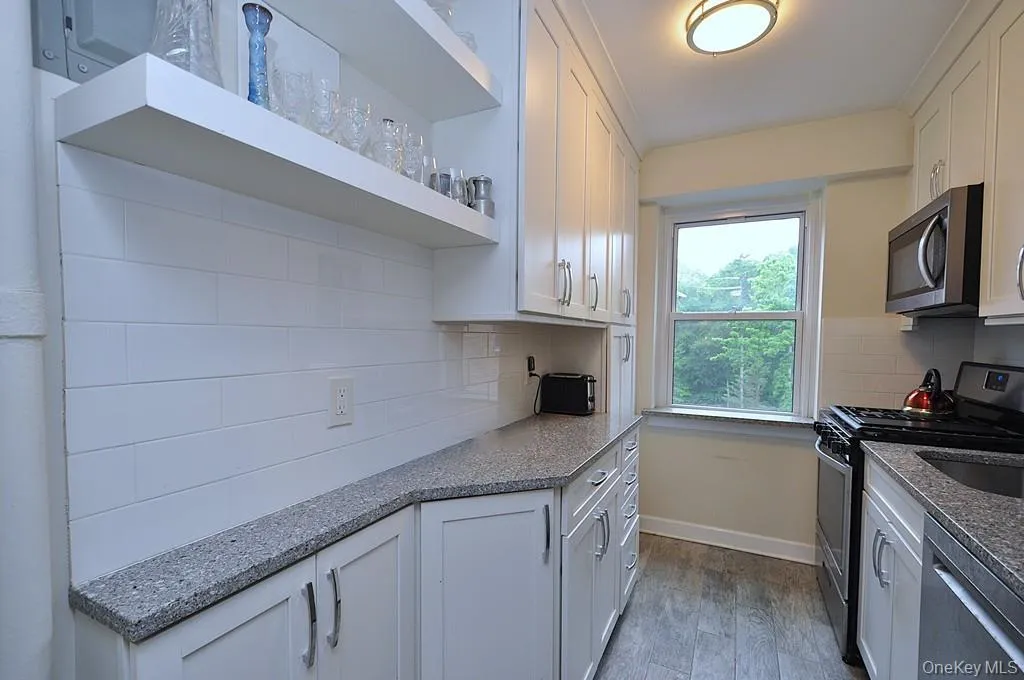 New Kitchen with Granite Counters, Stainless Steel Appliances including a dishwasher, microwave, rang and refrigerator. New Kitchen with Granite Counters, Stainless Steel Appliances including a dishwasher, microwave, rang and refrigerator.