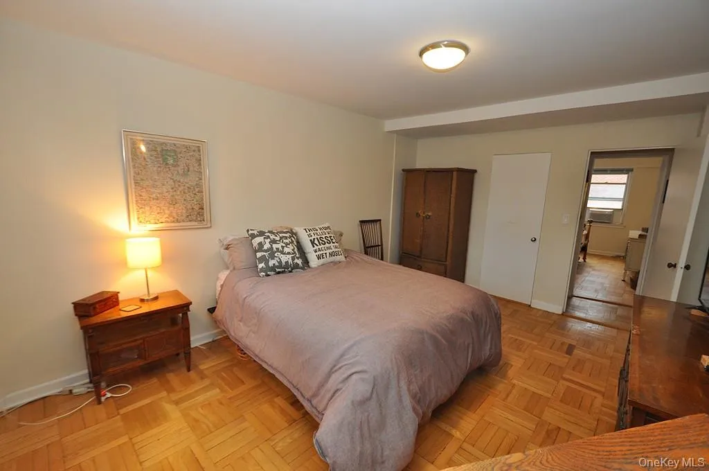 The primary bedroom has parquet floors, two large closets and access to the full bath. The bedroom is approx 16'-6" x 11'-8" The primary bedroom has parquet floors, two large closets and access to the full bath. The bedroom is approx 16'-6" x 11'-8"