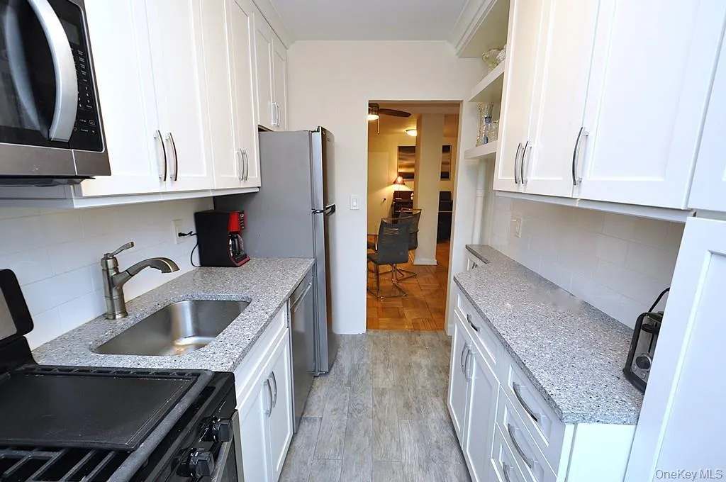 New Kitchen with Granite Counters, Stainless Steel Appliances including a dishwasher, microwave, rang and refrigerator. New Kitchen with Granite Counters, Stainless Steel Appliances including a dishwasher, microwave, rang and refrigerator.